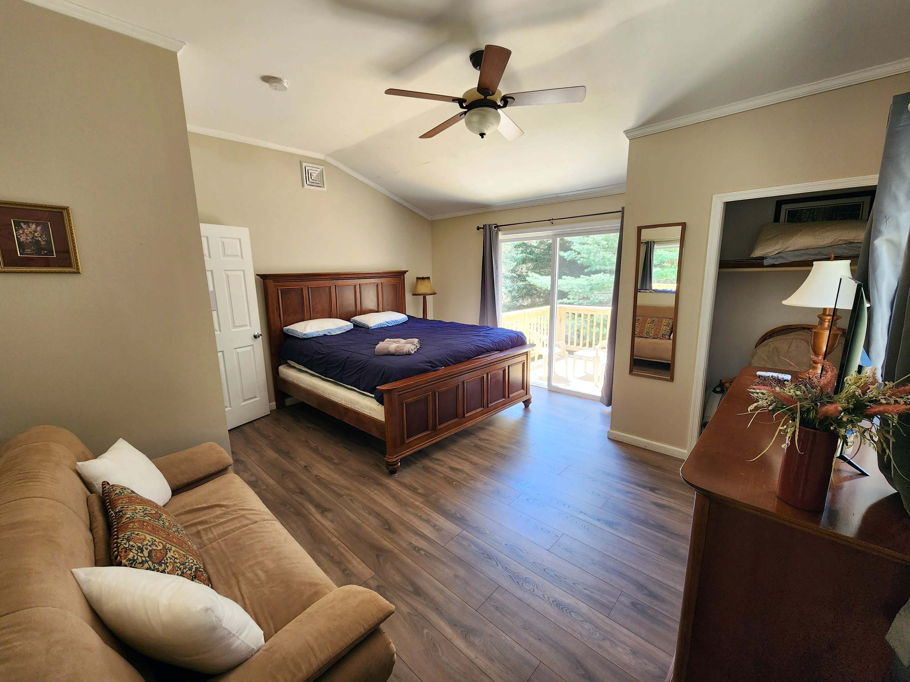 Wake up to treetop views through the window in this inviting bedroom