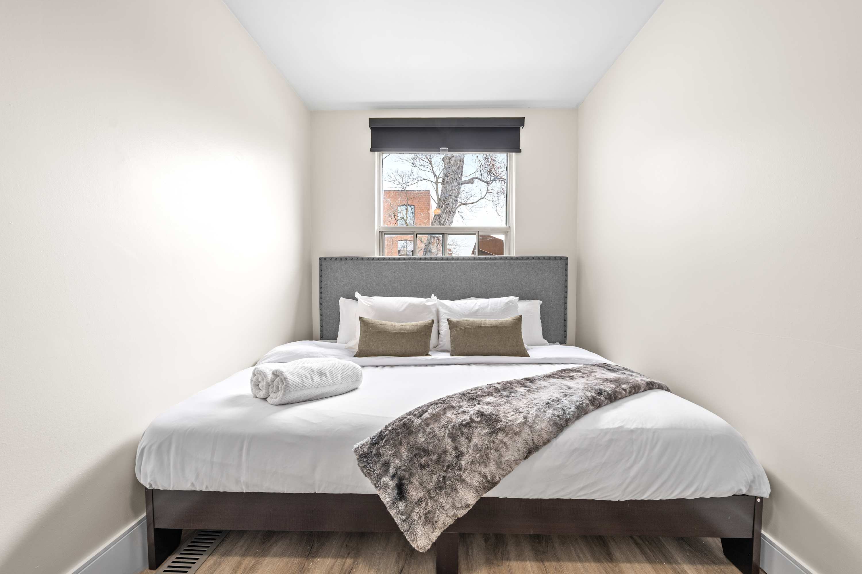 Relax on a large, inviting bed with fresh linens