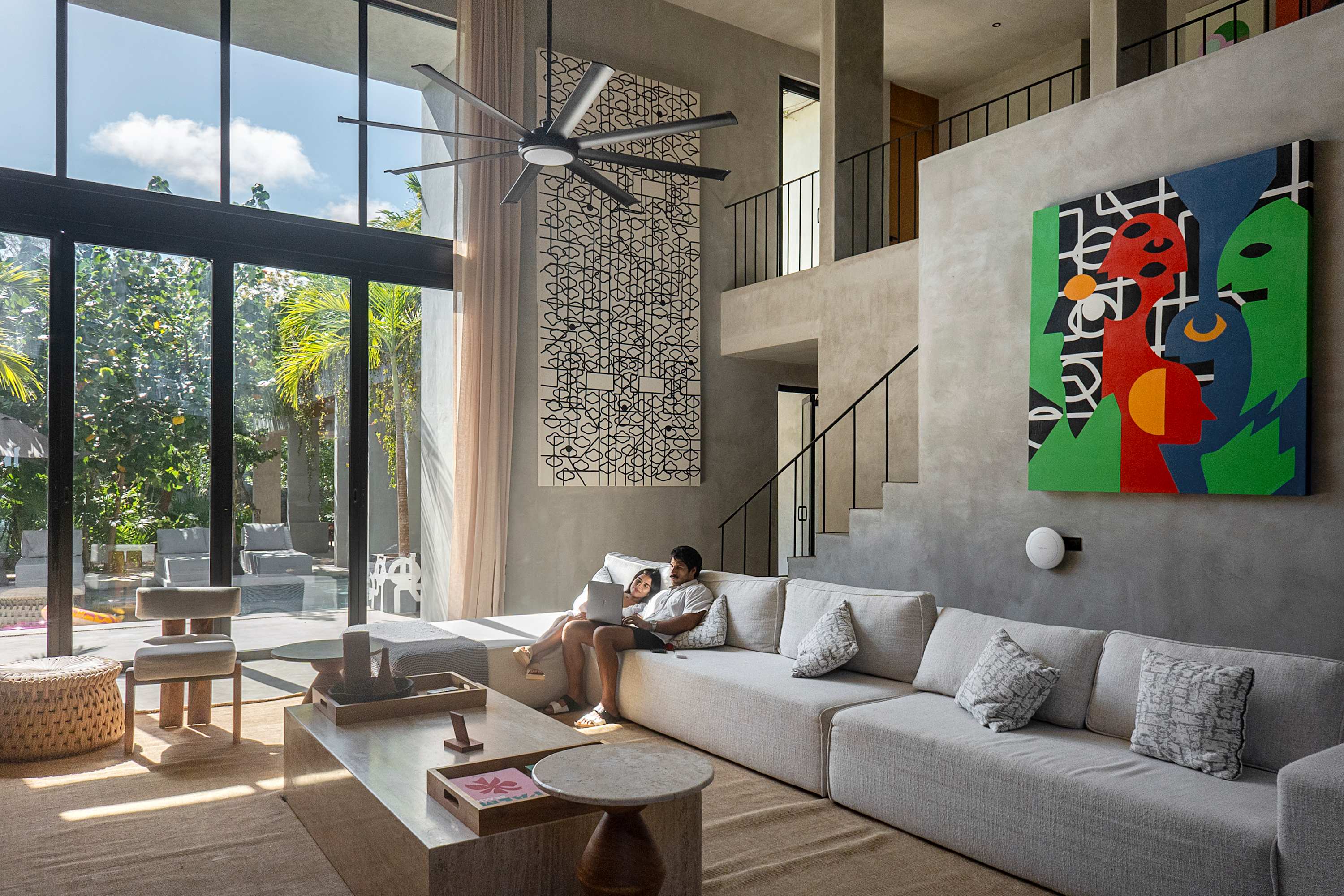 Expansive living room designed for both productivity and relaxation—ideal for working from home or socializing with friends.