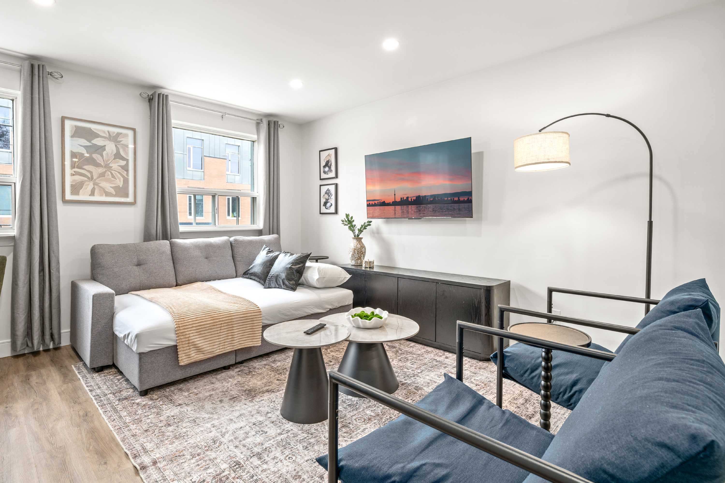 A cozy spot to lounge or sleep while enjoying entertainment at hand