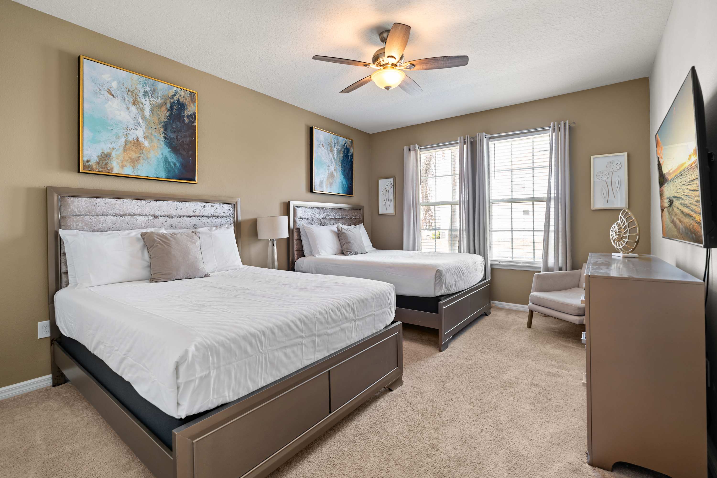Bedroom with two queen beds and headboards, perfect for relaxing, unwinding, and restful sleep