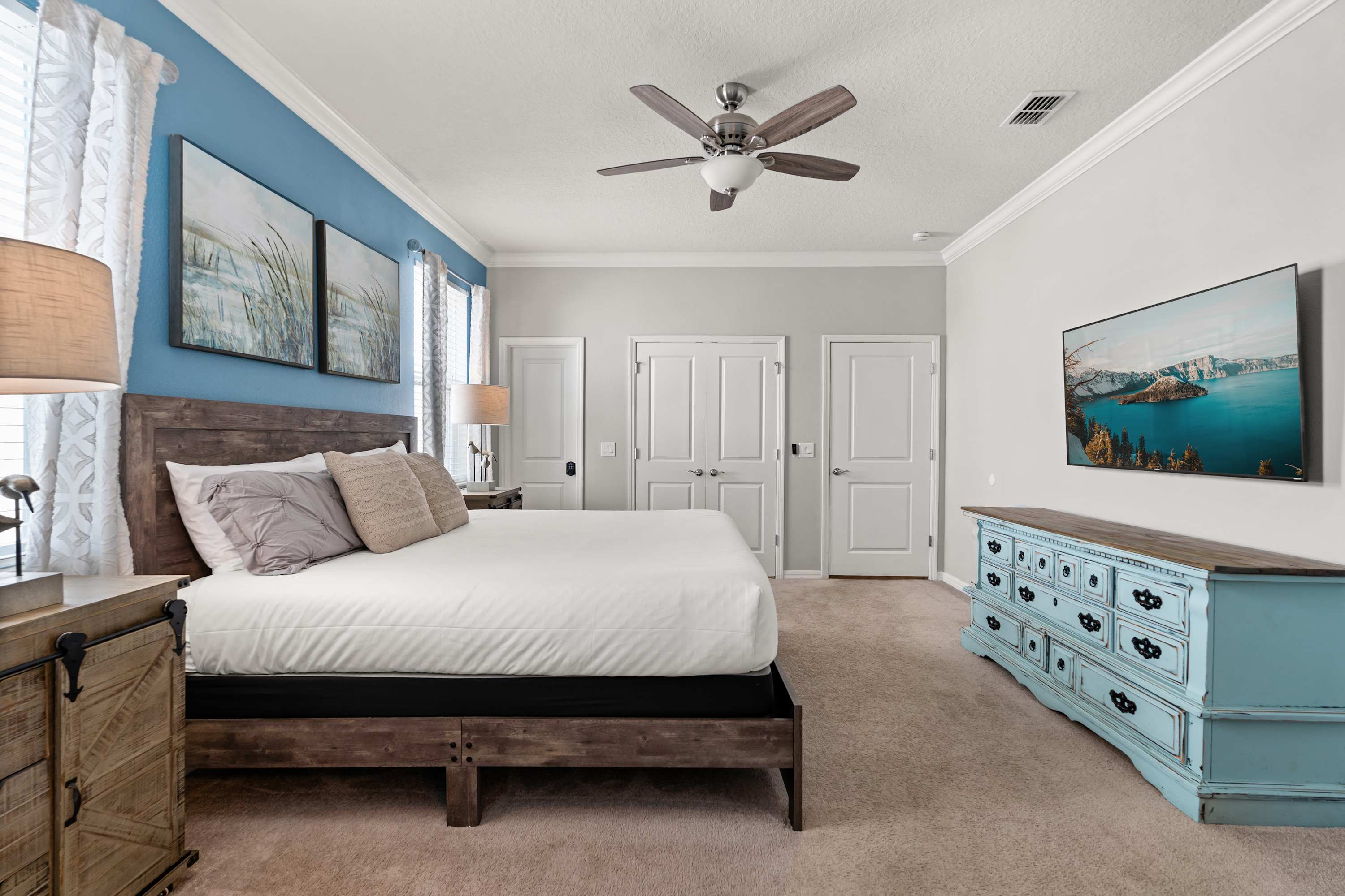 Spacious king bedroom with 65-inch smart TV, perfect for relaxing, unwinding, and settling in