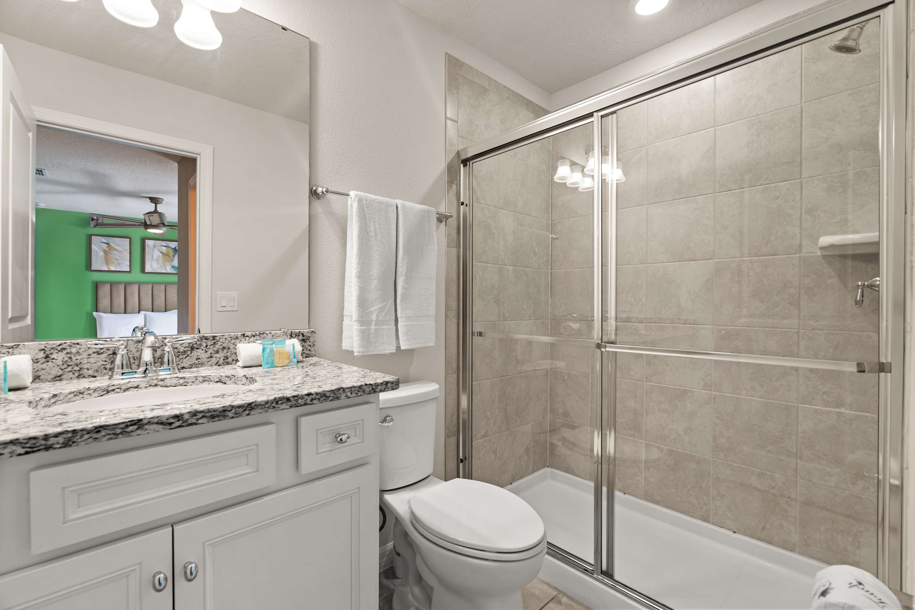 Bathroom with walk-in shower and essentials, ready for a refreshing and convenient stay