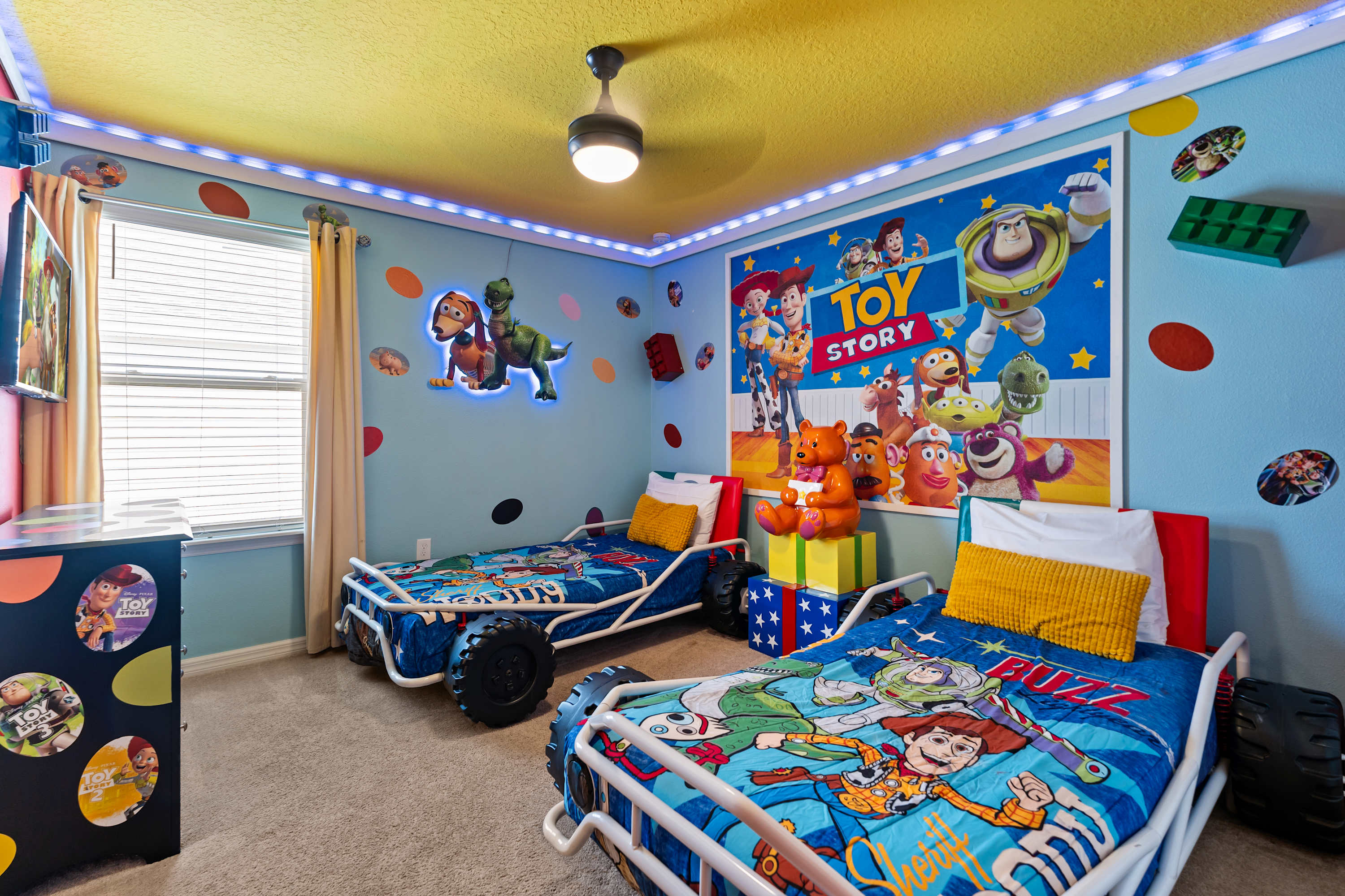 Kids can race into fun in a Toy Story-themed room with car-shaped beds and space to play