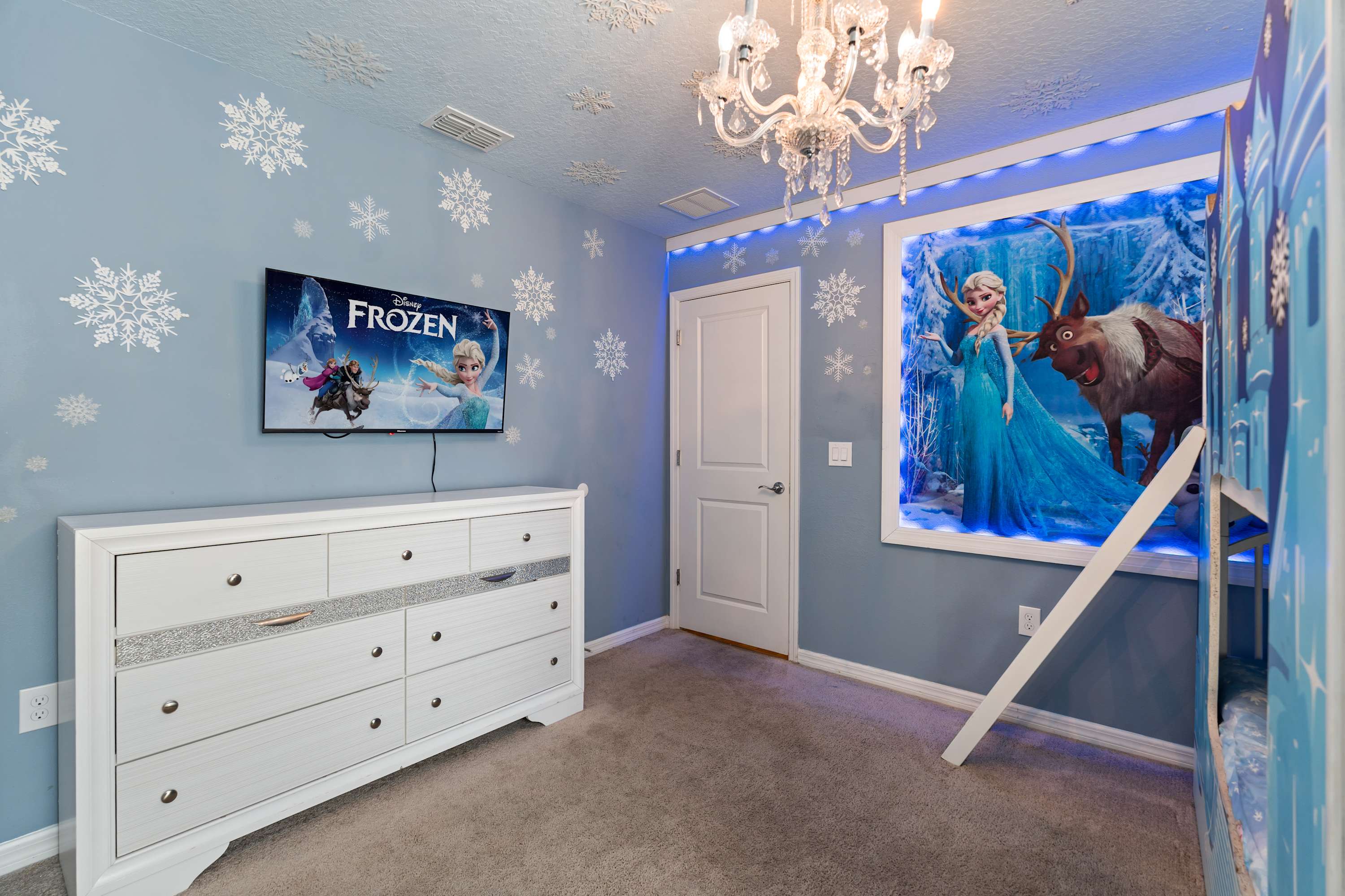 Frozen room with 55-inch TV, where kids can watch shows and imagine adventures from their beds