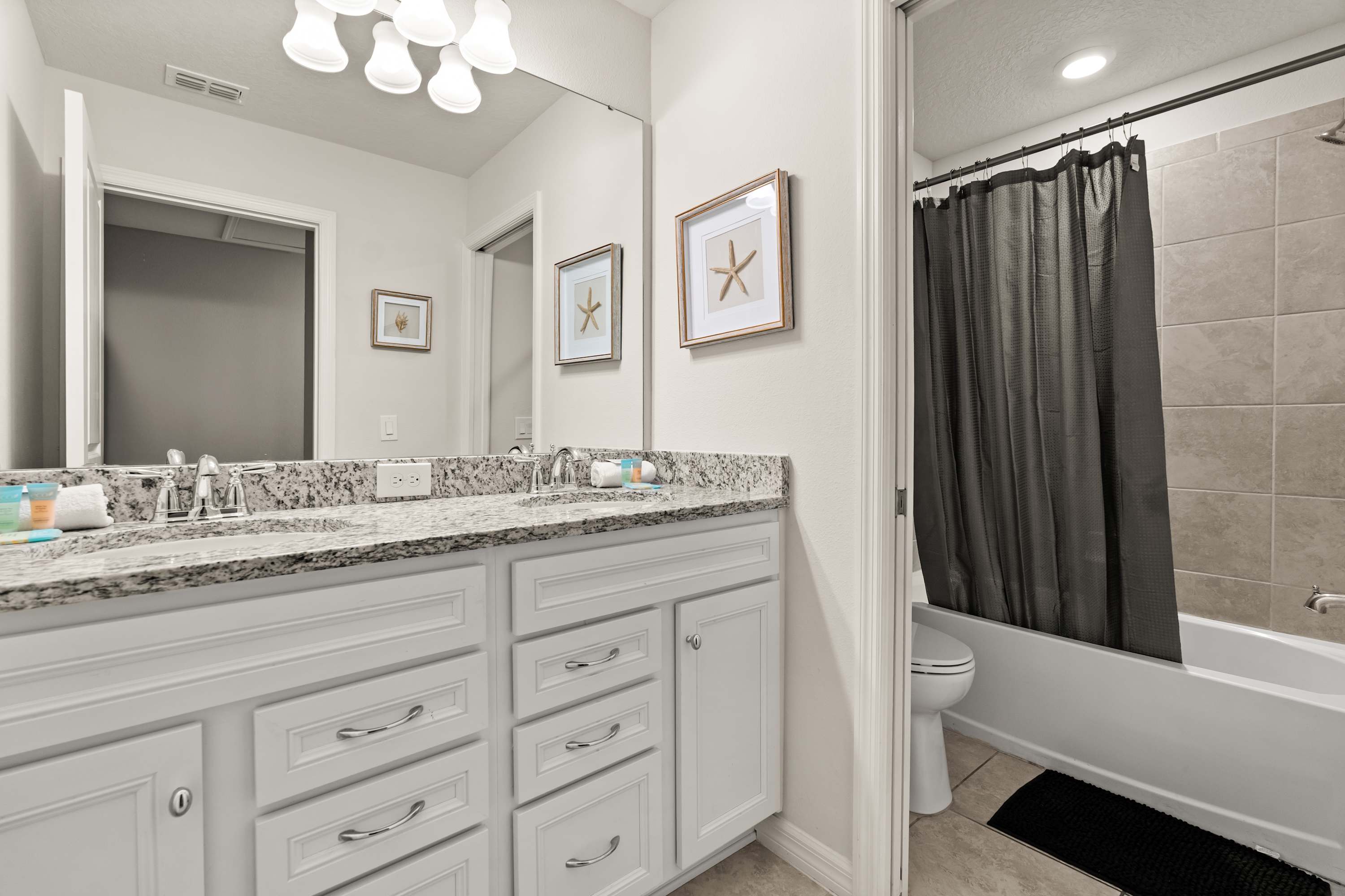 Bathroom with walk-in shower, tub, and double sinks, perfect for fun and easy refresh