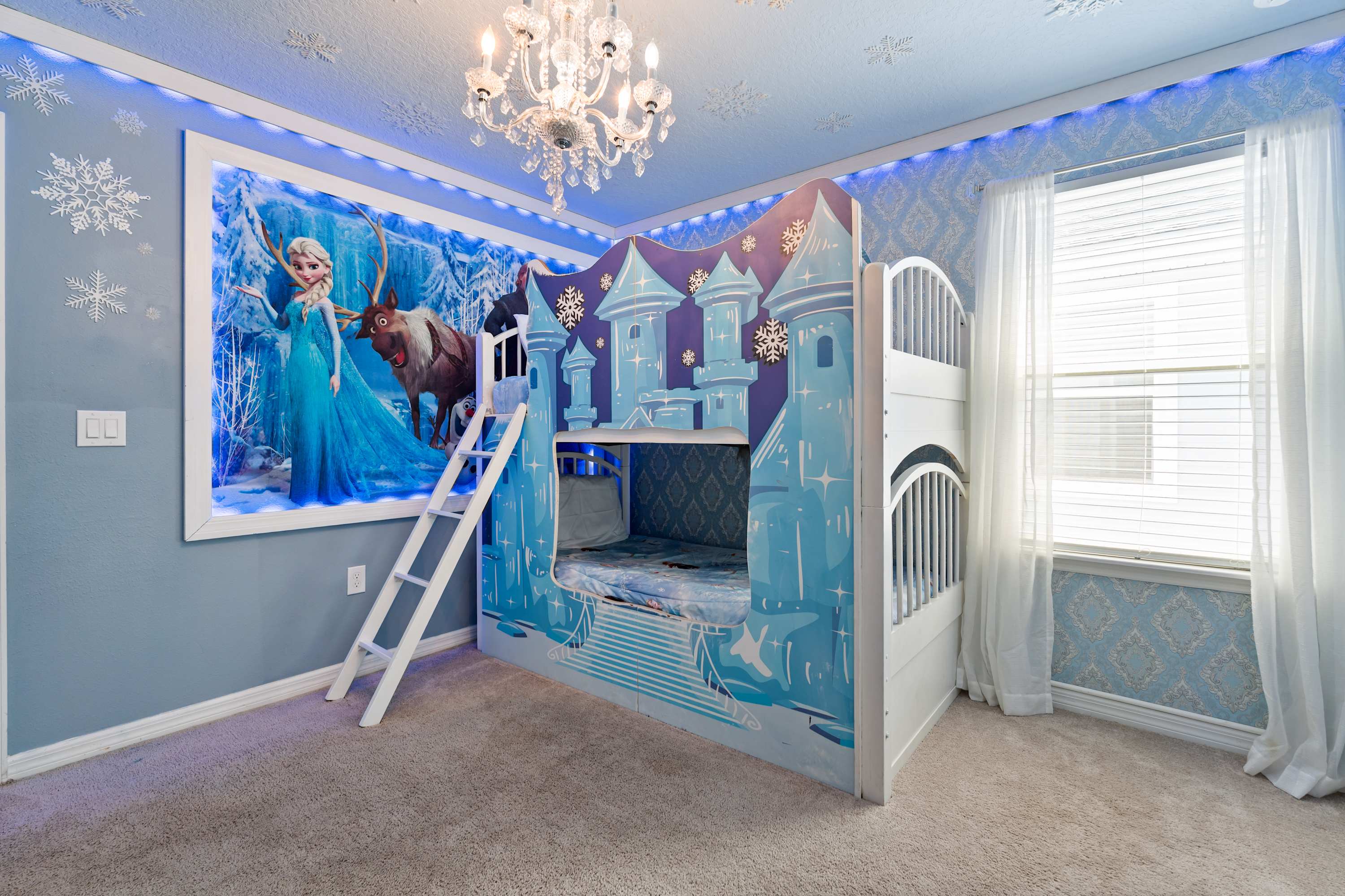 Step into a Frozen ice castle with double-deck beds, where kids can sleep, play, and imagine