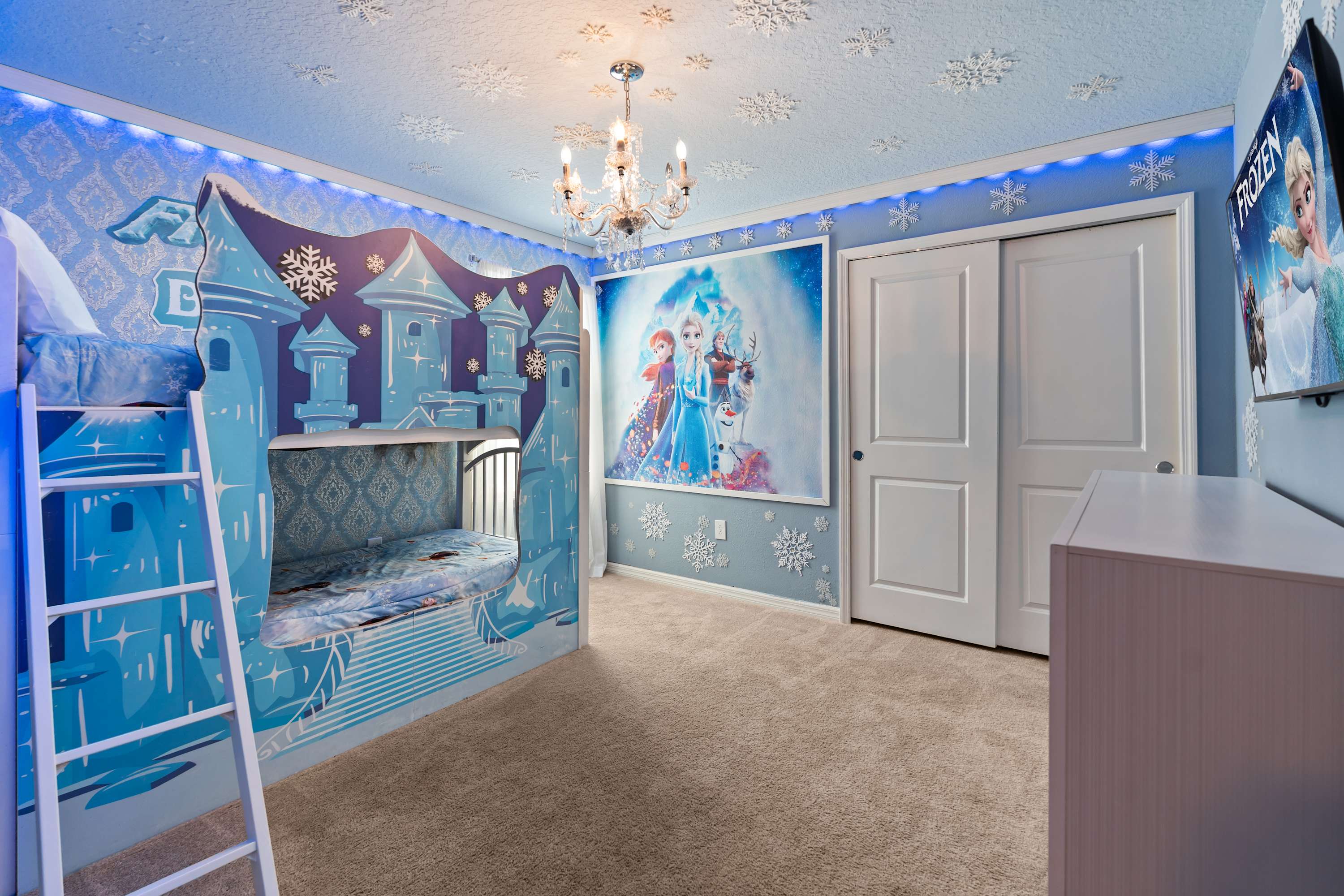 Spacious Frozen room with character-framed walls and wardrobe, perfect for kids to imagine and play