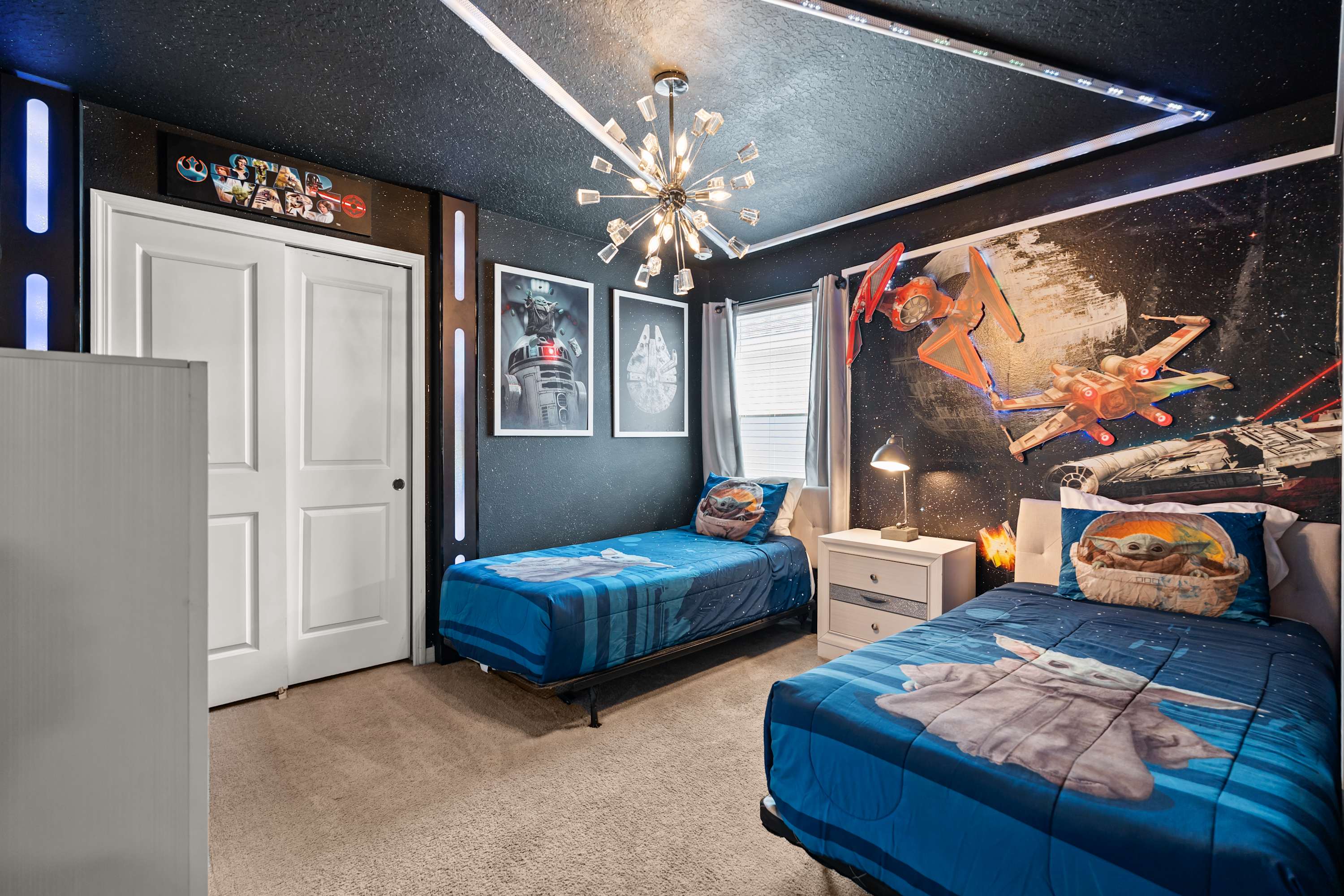 Star Wars room with two single beds, surrounded by starships, where young Jedi can battle and play