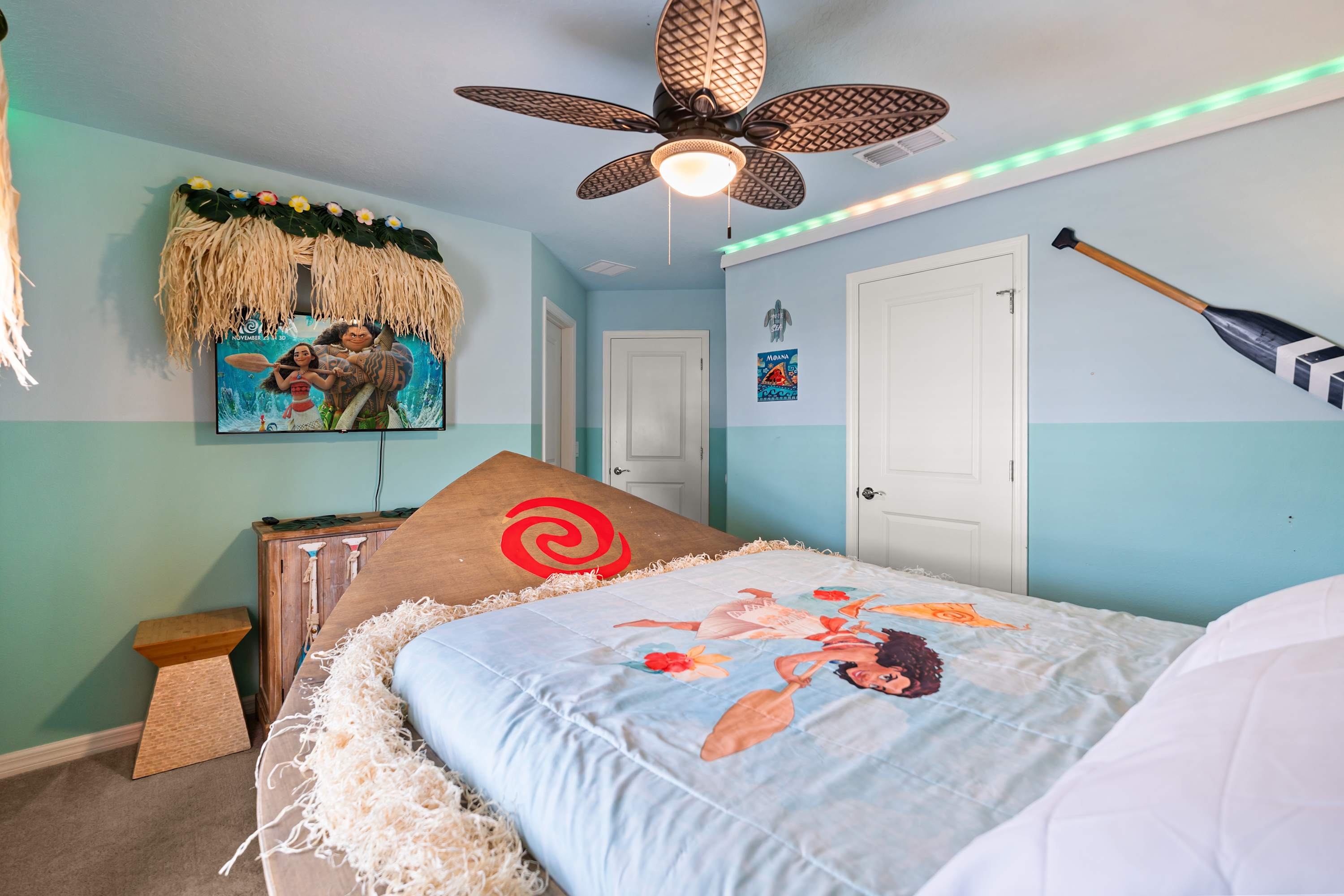 Moana room with 55-inch TV, perfect for kids to watch shows and sail into adventure