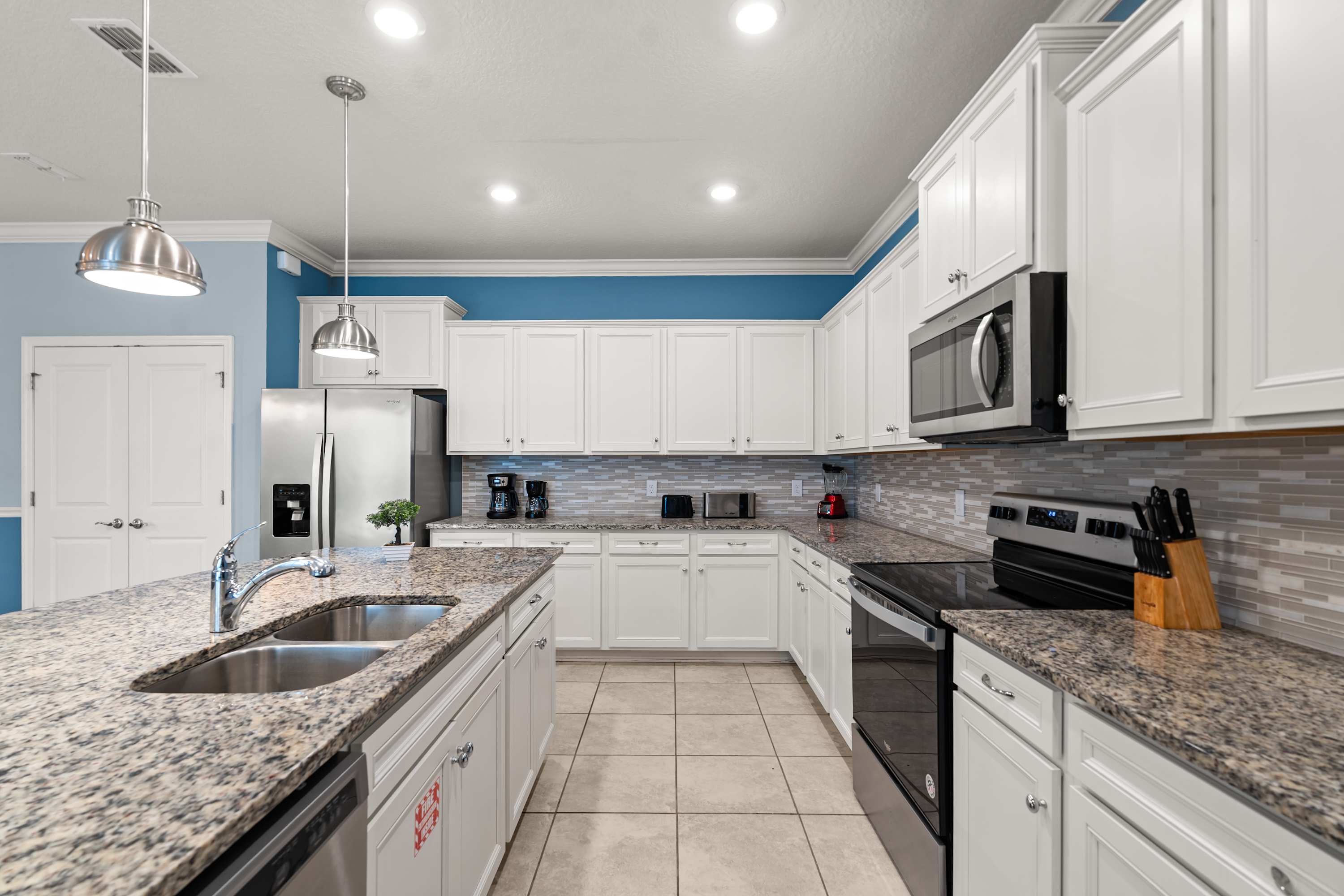 Kitchen with full setup and center island ideal for cooking, prepping, and sharing meals