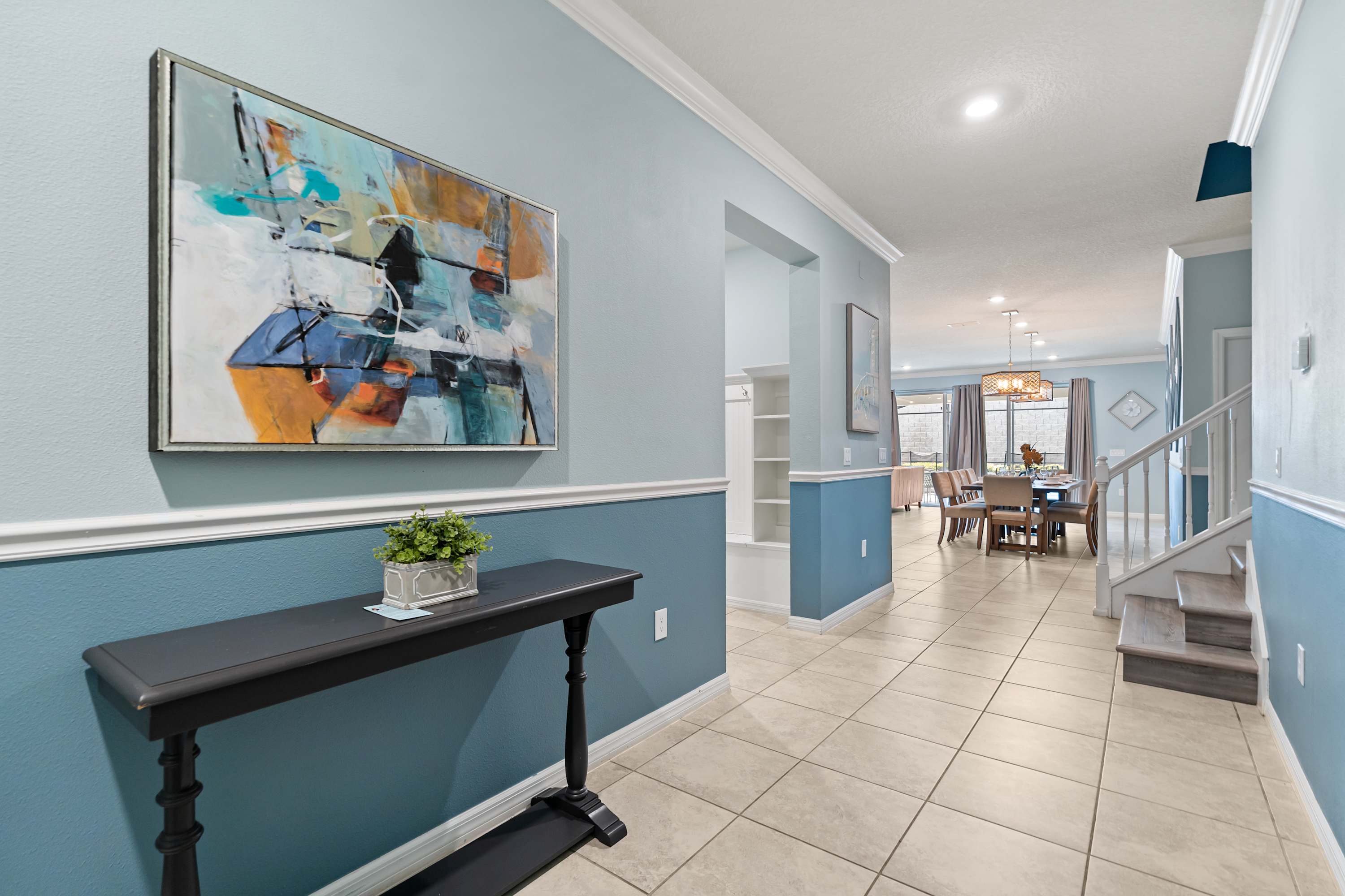 Hallway connecting to the second floor and main area, guiding guests through spacious, open living