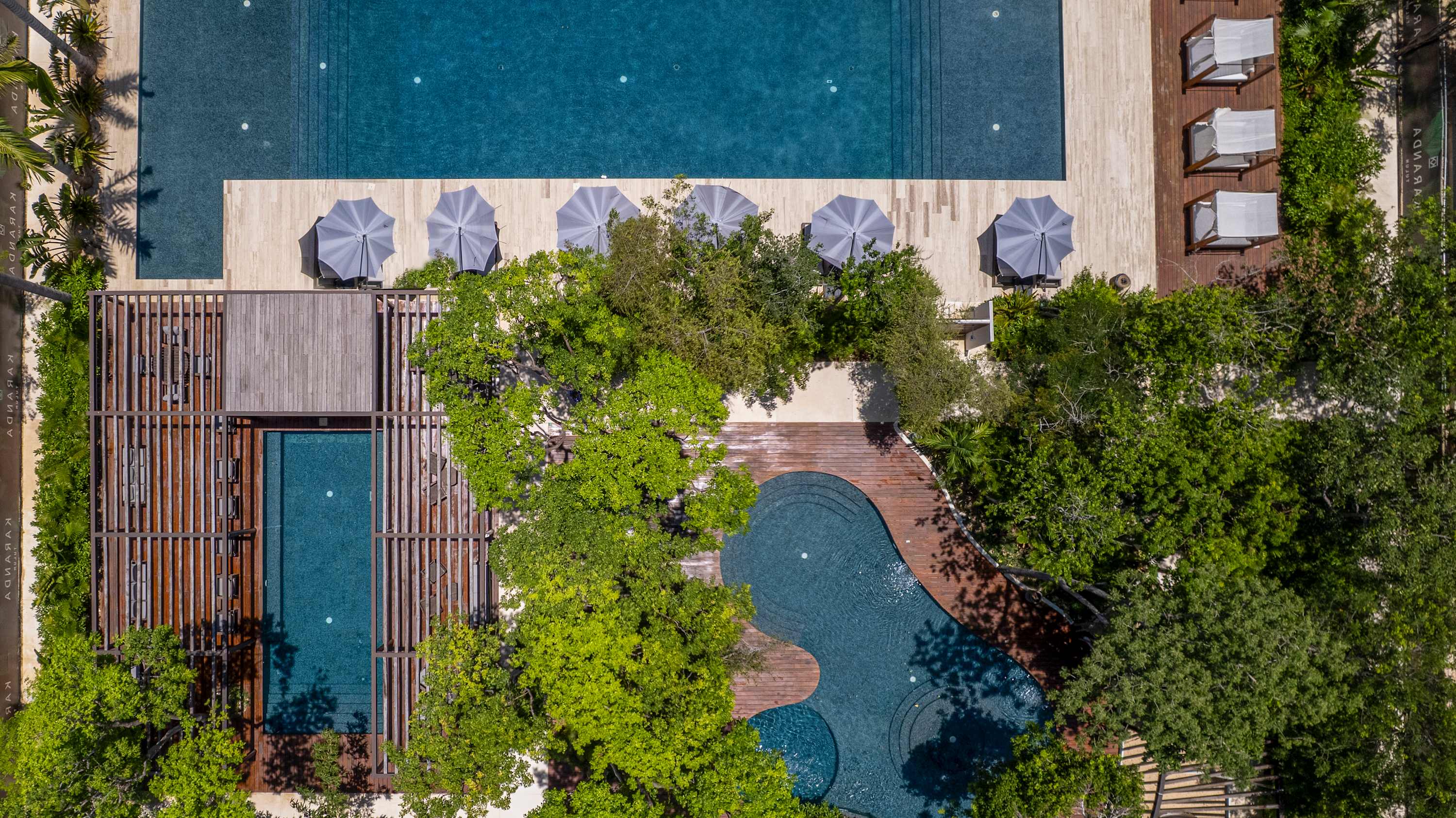 Drone view of the three gorgeous shared pools at the Karanda complex, enjoyed together with other guests.