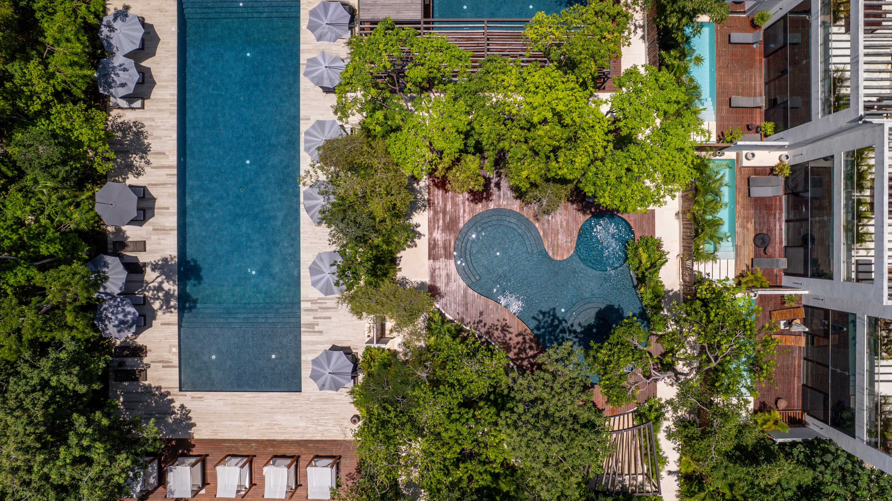 Drone view of the three gorgeous shared pools at the Karanda complex, enjoyed together with other guests.
