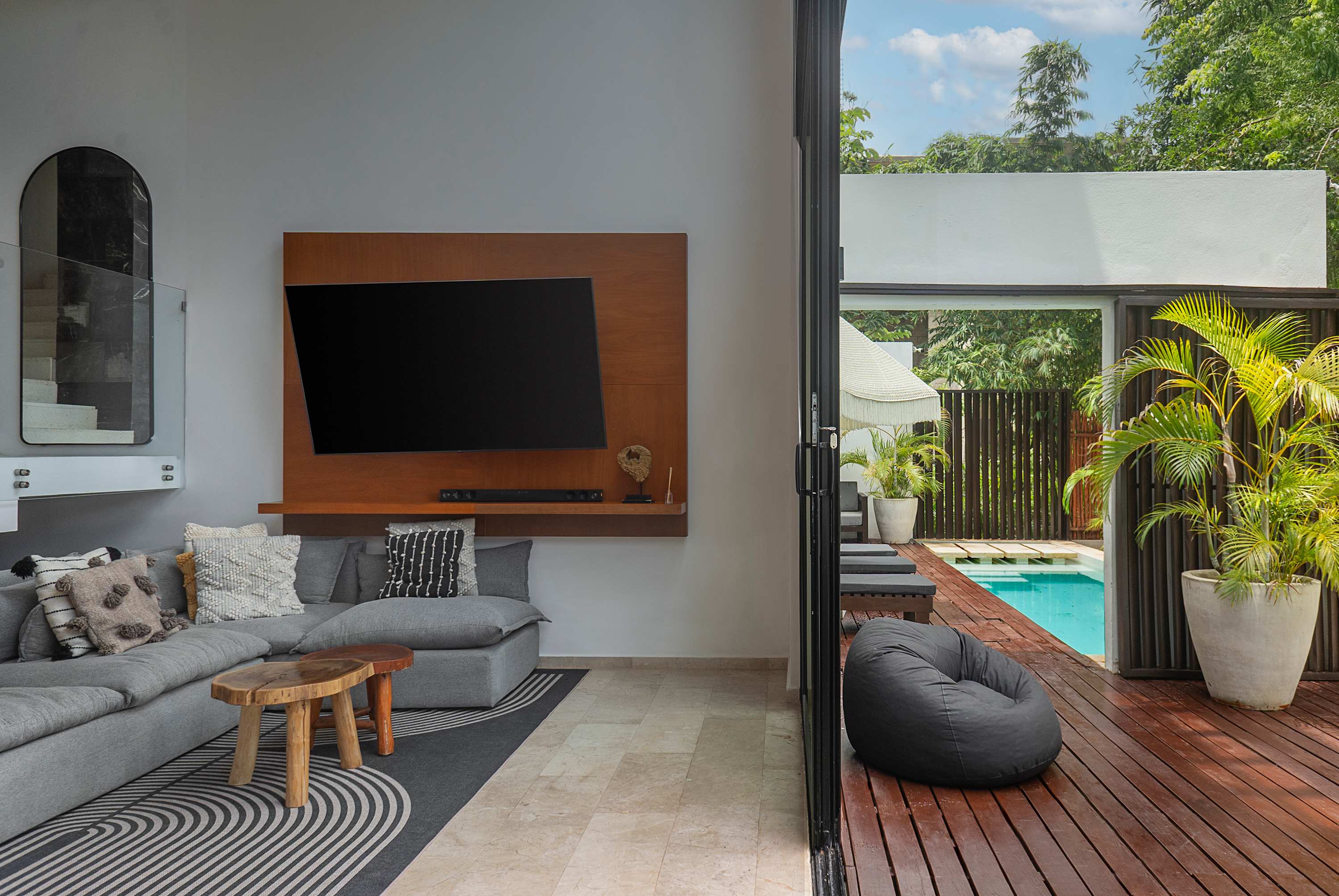 
Private pool with a patio door that opens toward the villa next door for easy access.