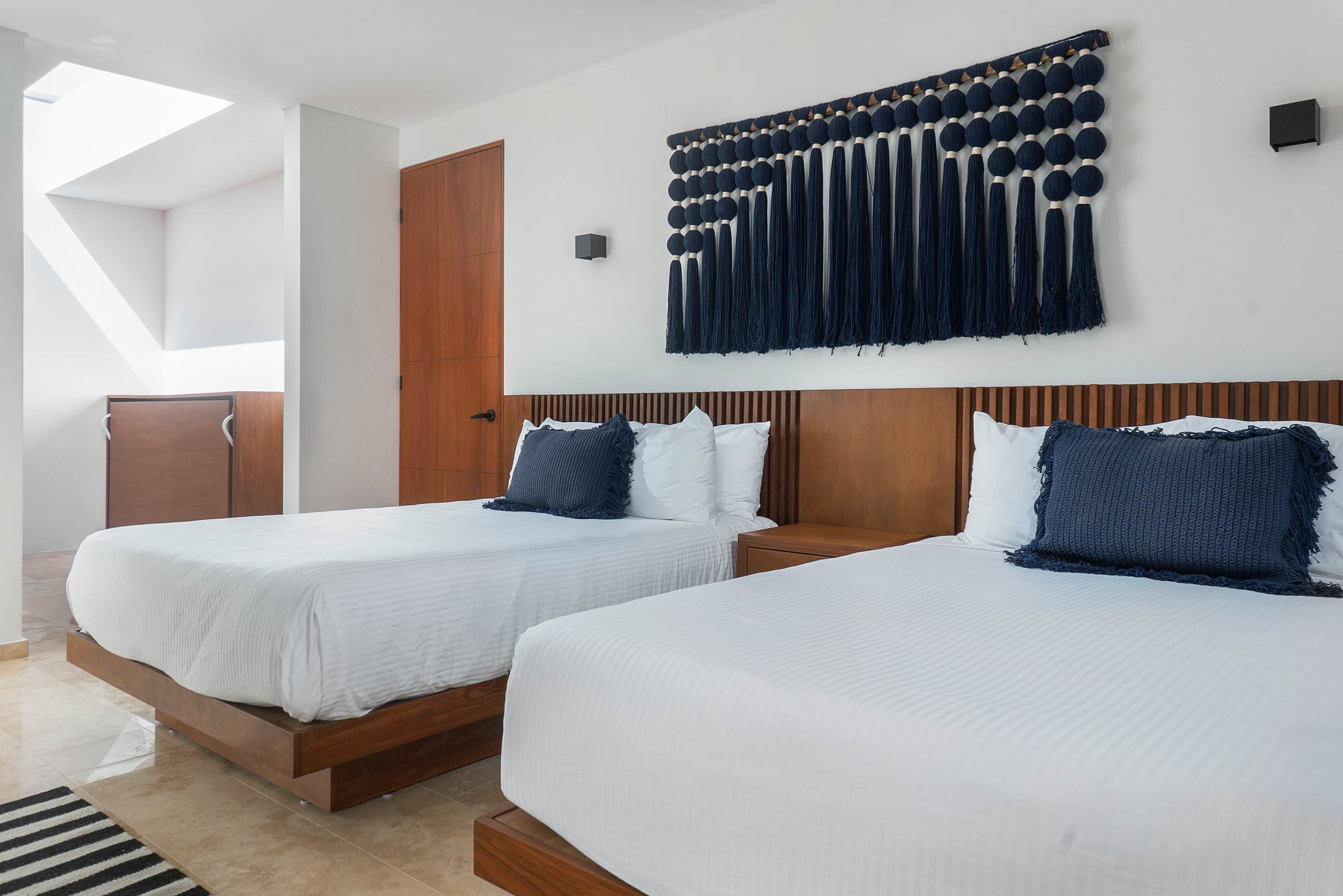 Bedrooms #4, #8, #12, and #16 are representative of the same layout and design across the four villas. While décor details may vary slightly, all rooms are very similar—this image is provided as a reference.