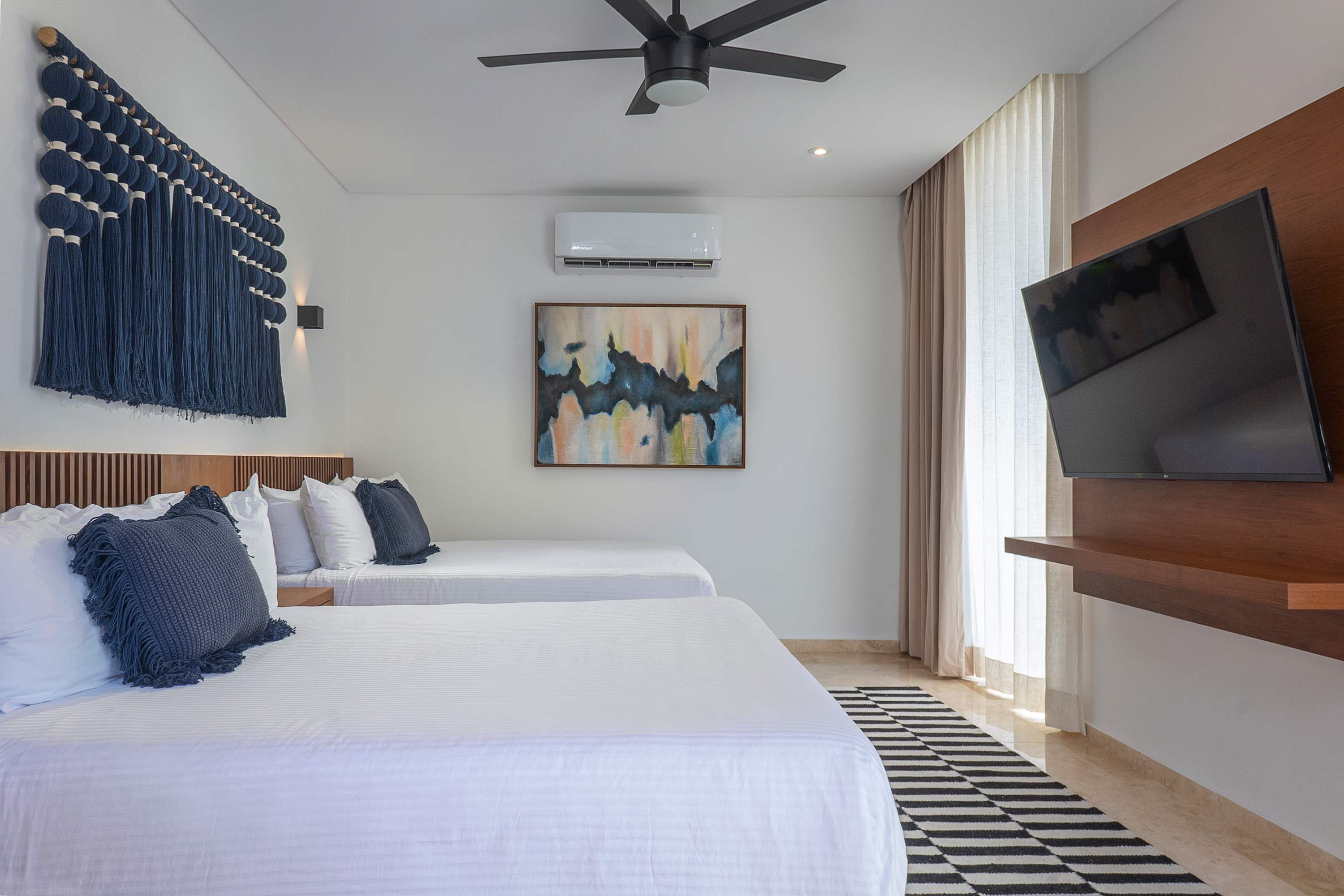 Bedrooms #4, #8, #12, and #16 are representative of the same layout and design across the four villas. While décor details may vary slightly, all rooms are very similar—this image is provided as a reference.