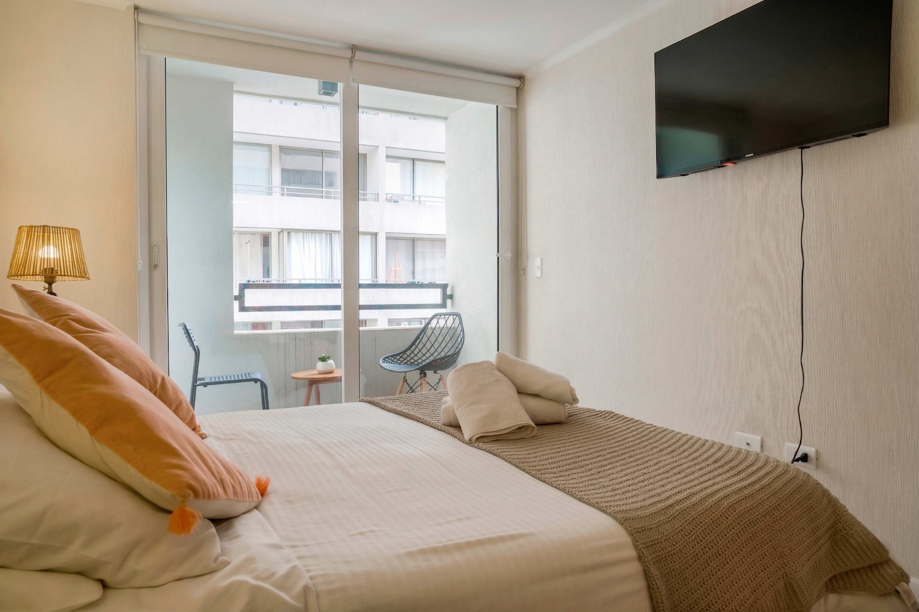 Relax in this cozy studio with a private balcony, perfect for enjoying your morning coffee.