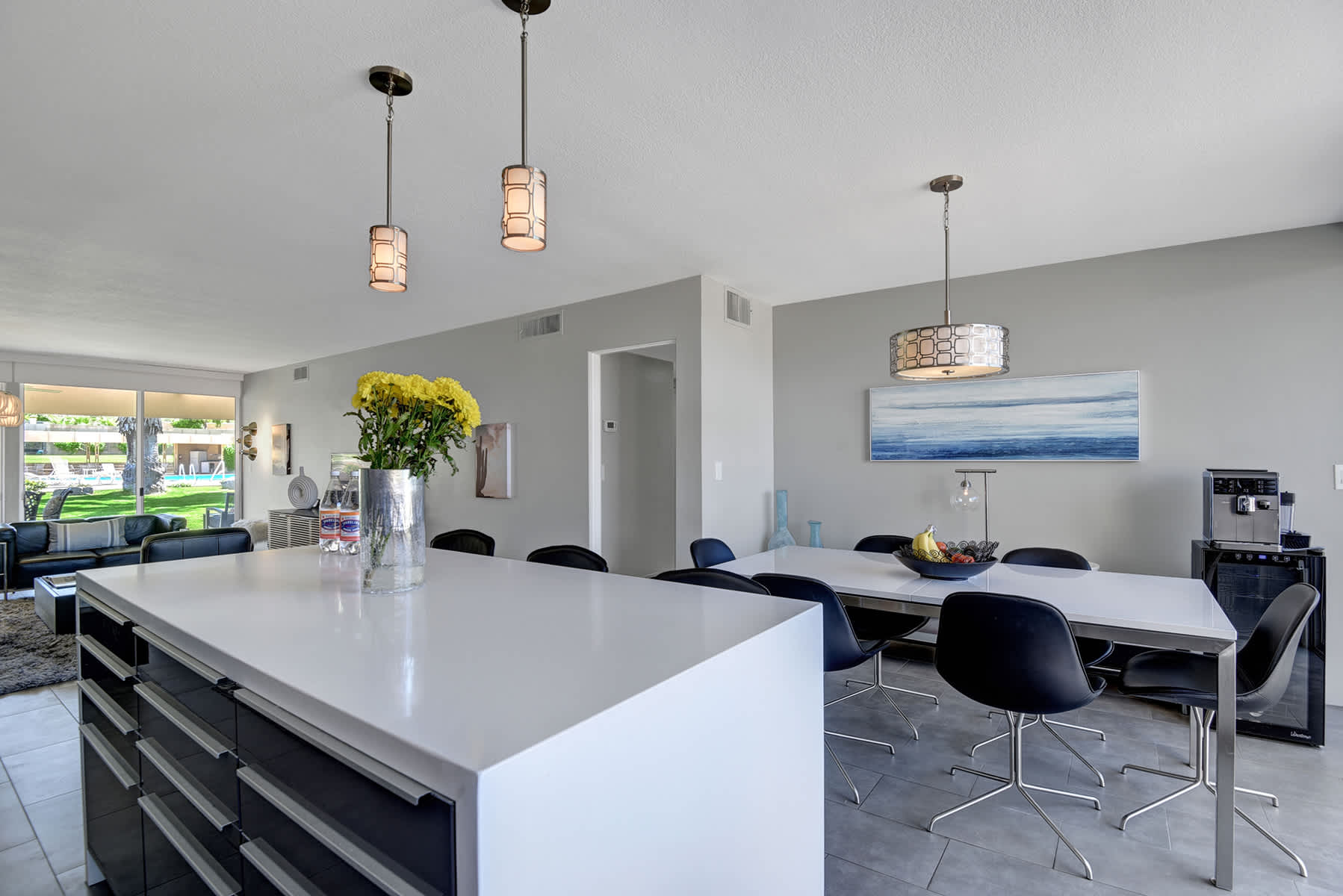 Dining table and kitchen island in the open-plan living space.