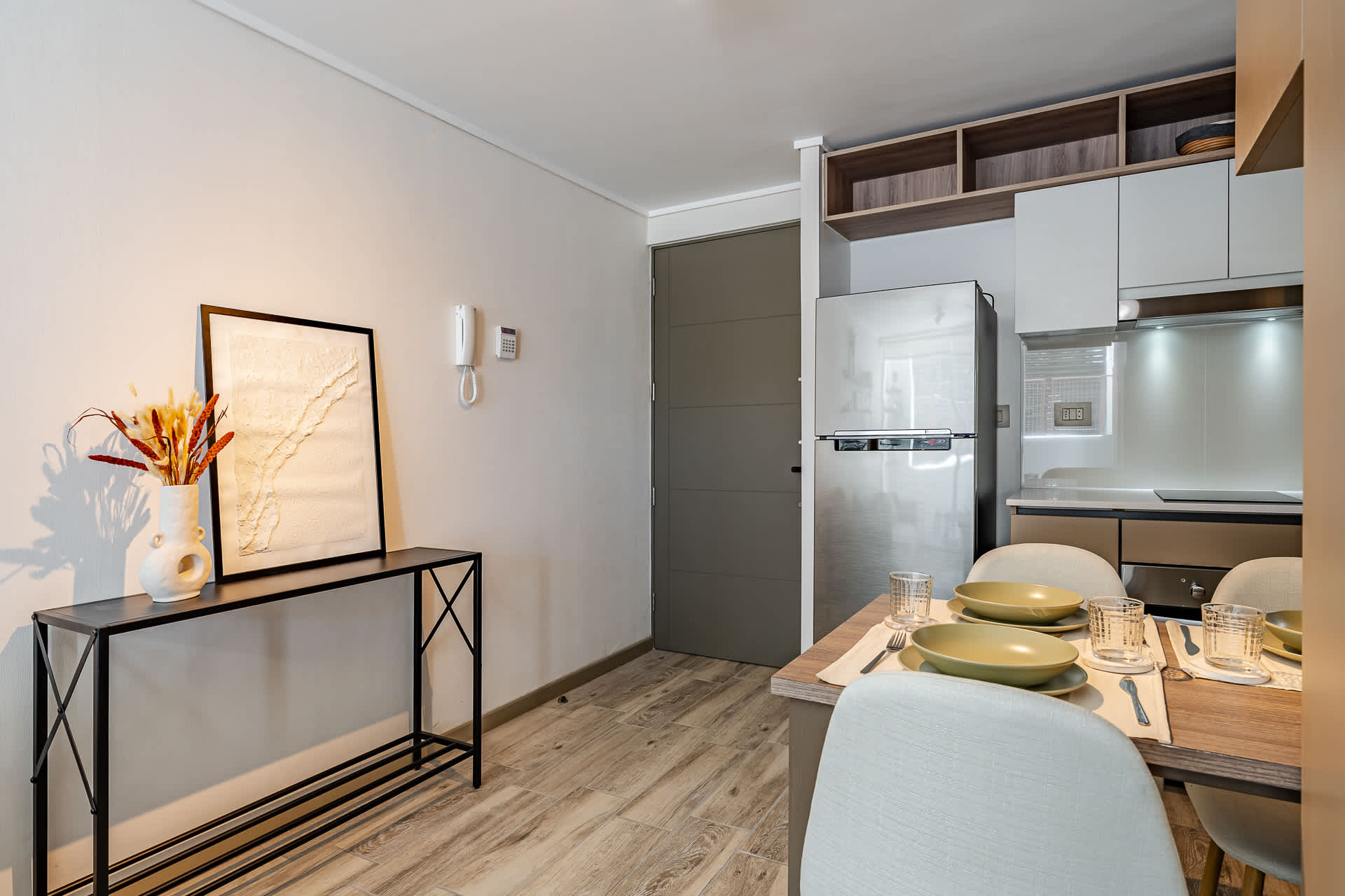 Cozy kitchen nook with modern amenities and stylish decor, perfect for intimate meals.