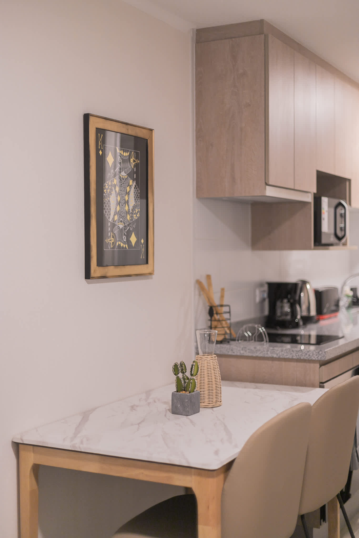 Cozy kitchen nook with modern appliances and stylish decor, perfect for a quick meal or morning coffee.