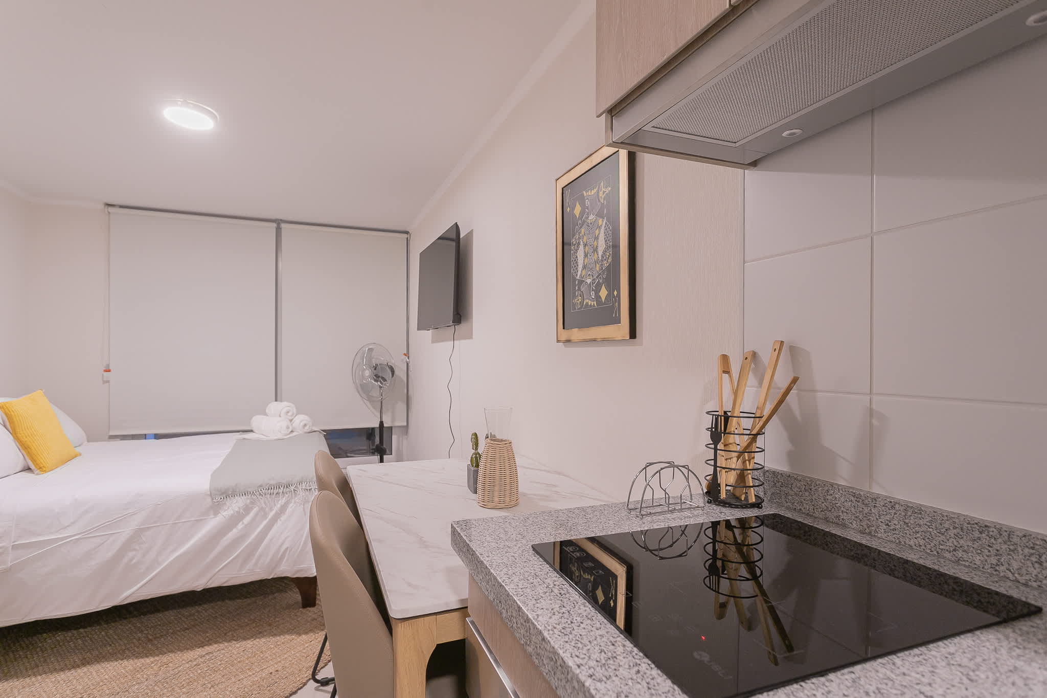 Cozy studio with modern kitchenette and comfortable sleeping area, perfect for a relaxing stay in the heart of the city.