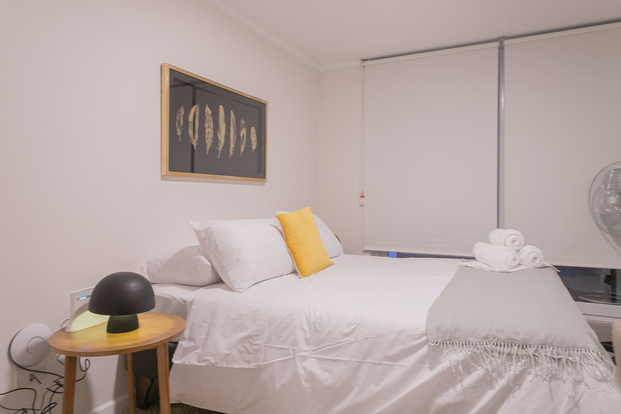 Cozy and inviting bedroom with modern decor and soft lighting, perfect for a restful stay.
