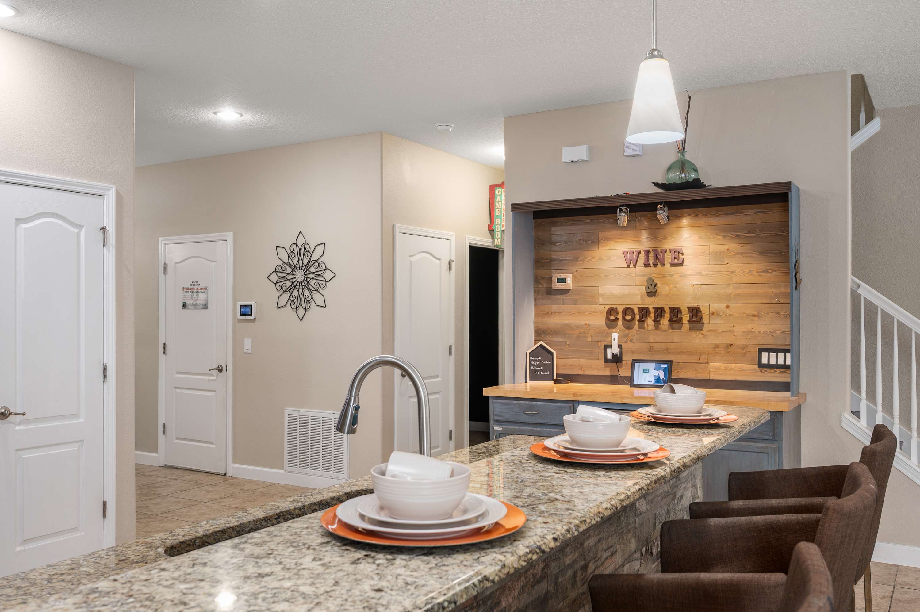 Open kitchen w/ island seating, modern finishes & room to gather together