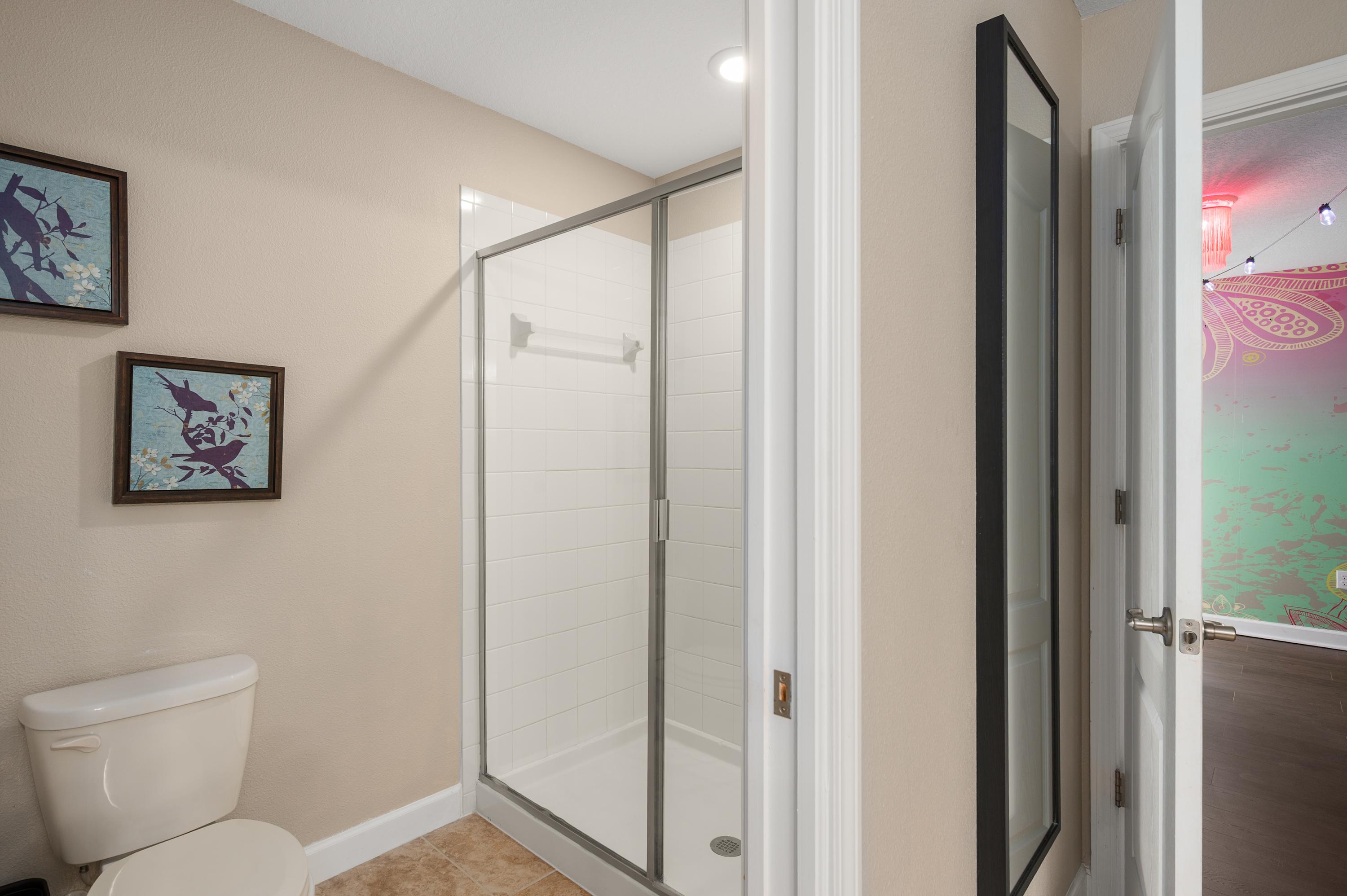 Clean bathroom w/ shower & tub combo for easy everyday routines
