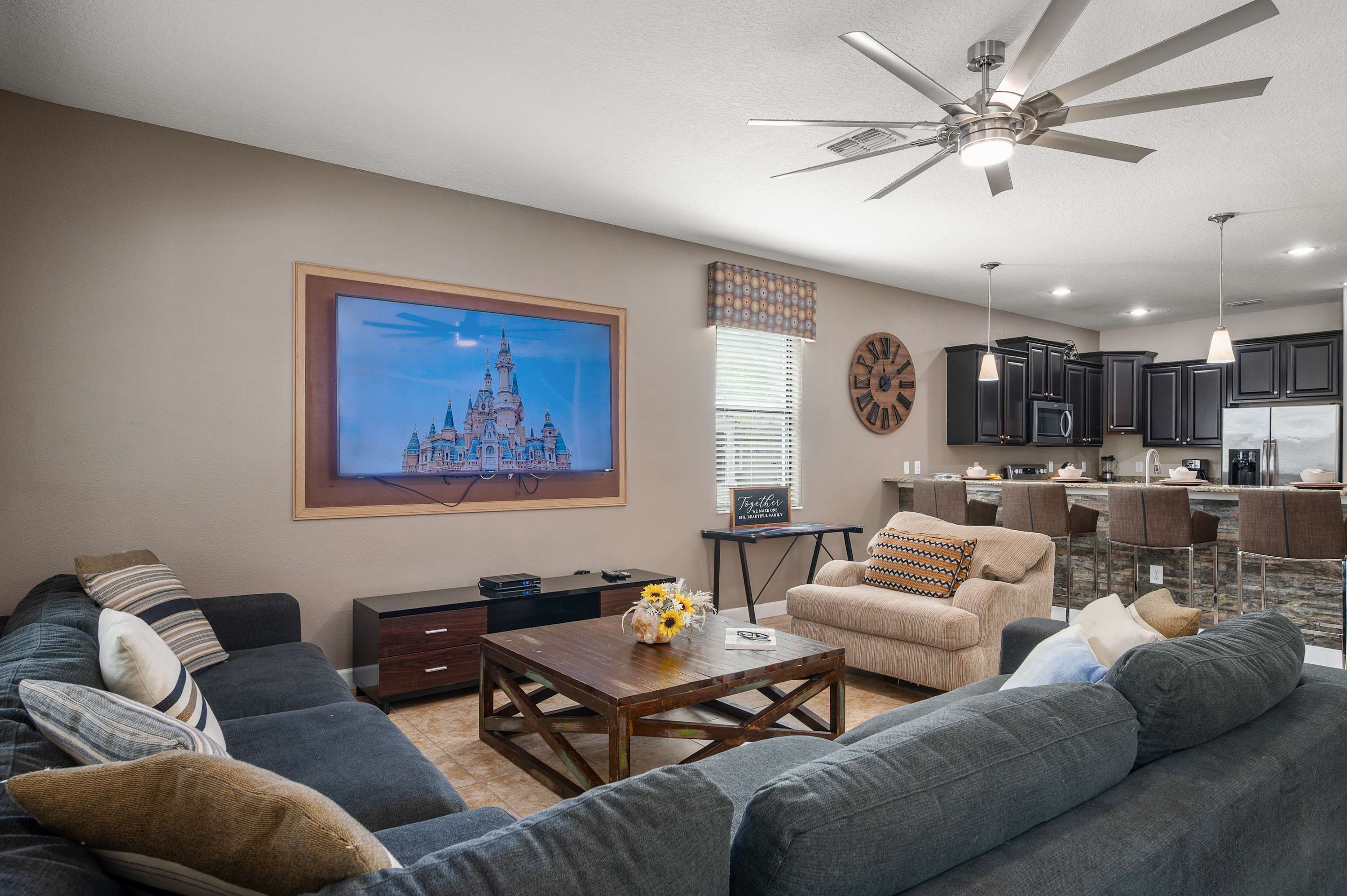 Spacious living room w/ plush seating, TV & open layout for gathering