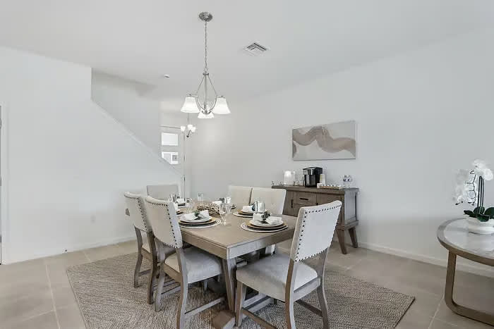 Elegant dining room with seating for six, perfect for family gatherings and entertaining.