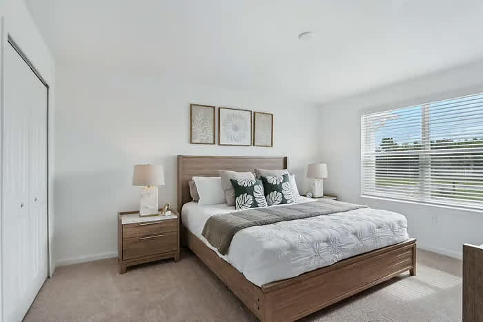 Relax in this spacious, sunlit bedroom with modern decor and serene views, perfect for unwinding after a day of adventure.