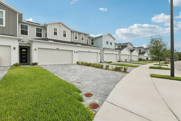 Explore this charming townhouse community with modern amenities and spacious garages, perfect for a comfortable stay.