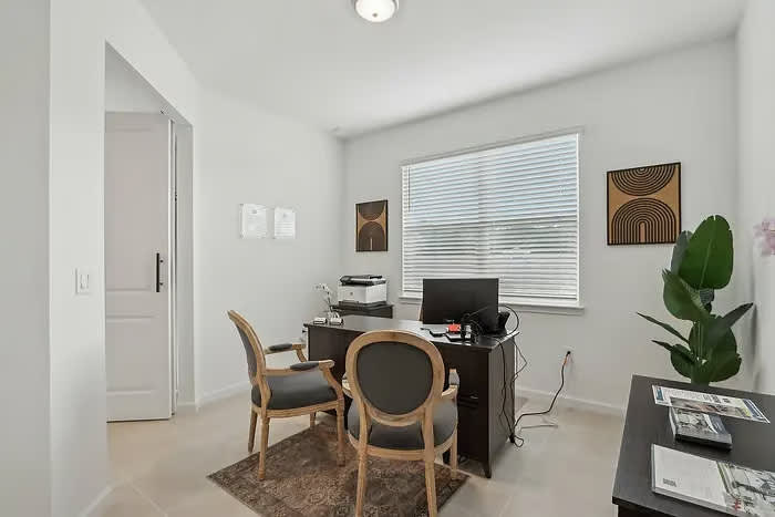 Cozy office space perfect for remote work with natural light and elegant decor.