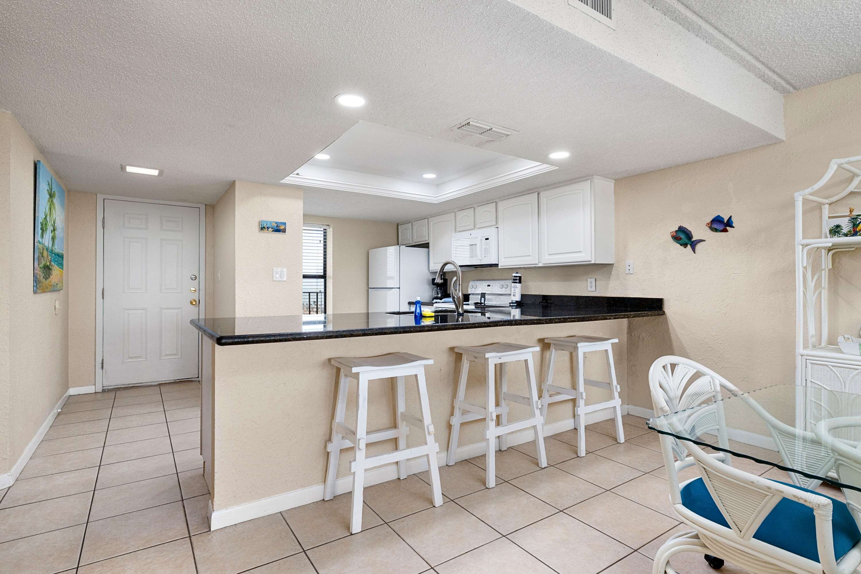 Cook, eat, and gather around the functional kitchen with seating