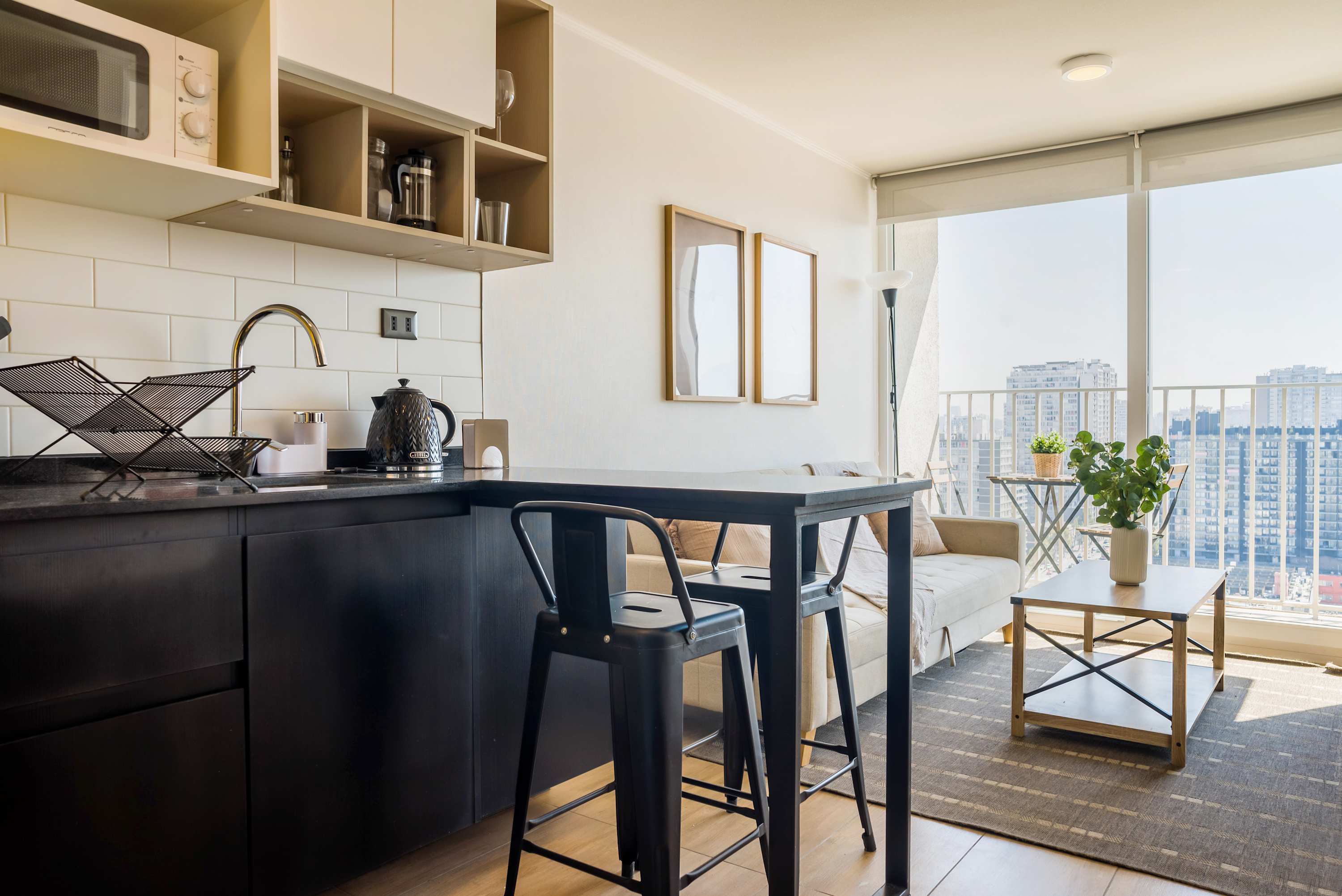Cozy studio with modern kitchen and stunning city views, perfect for a relaxing stay in the heart of the city.