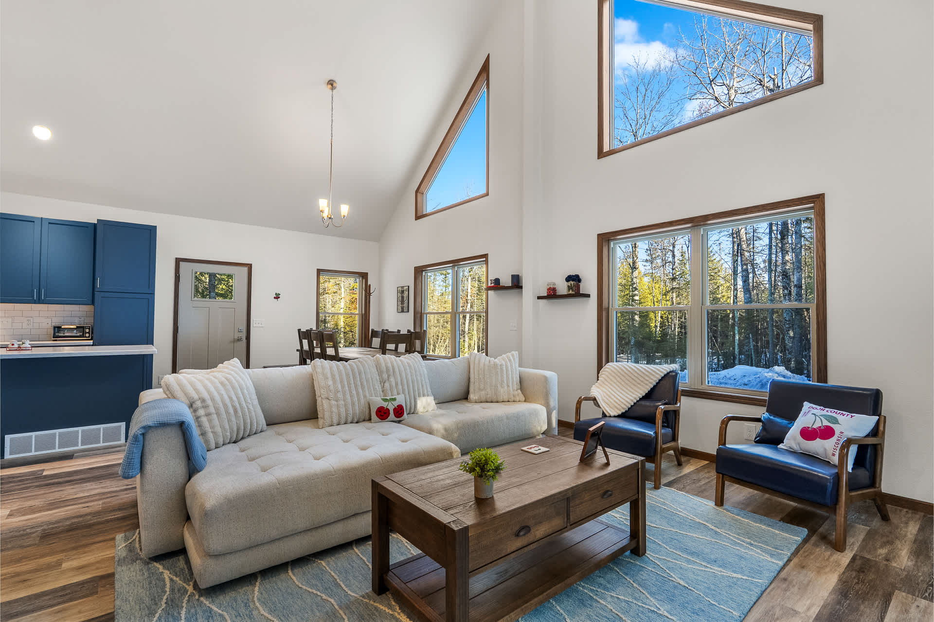 Modern forest retreat surrounded by golden autumn trees and natural landscape, offering peaceful seclusion.