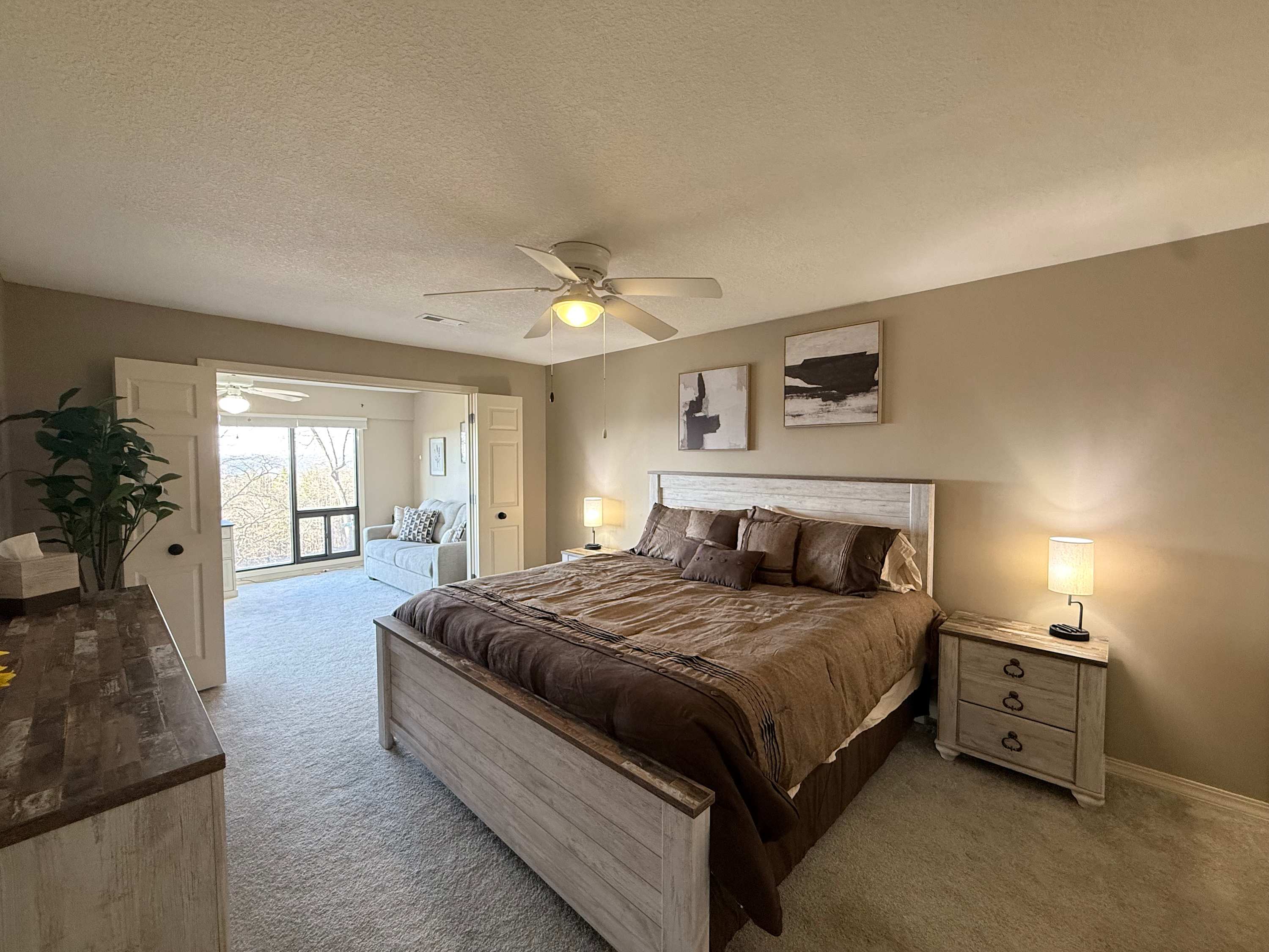 The primary king suite boasts a peaceful sitting area & an ensuite bath ​