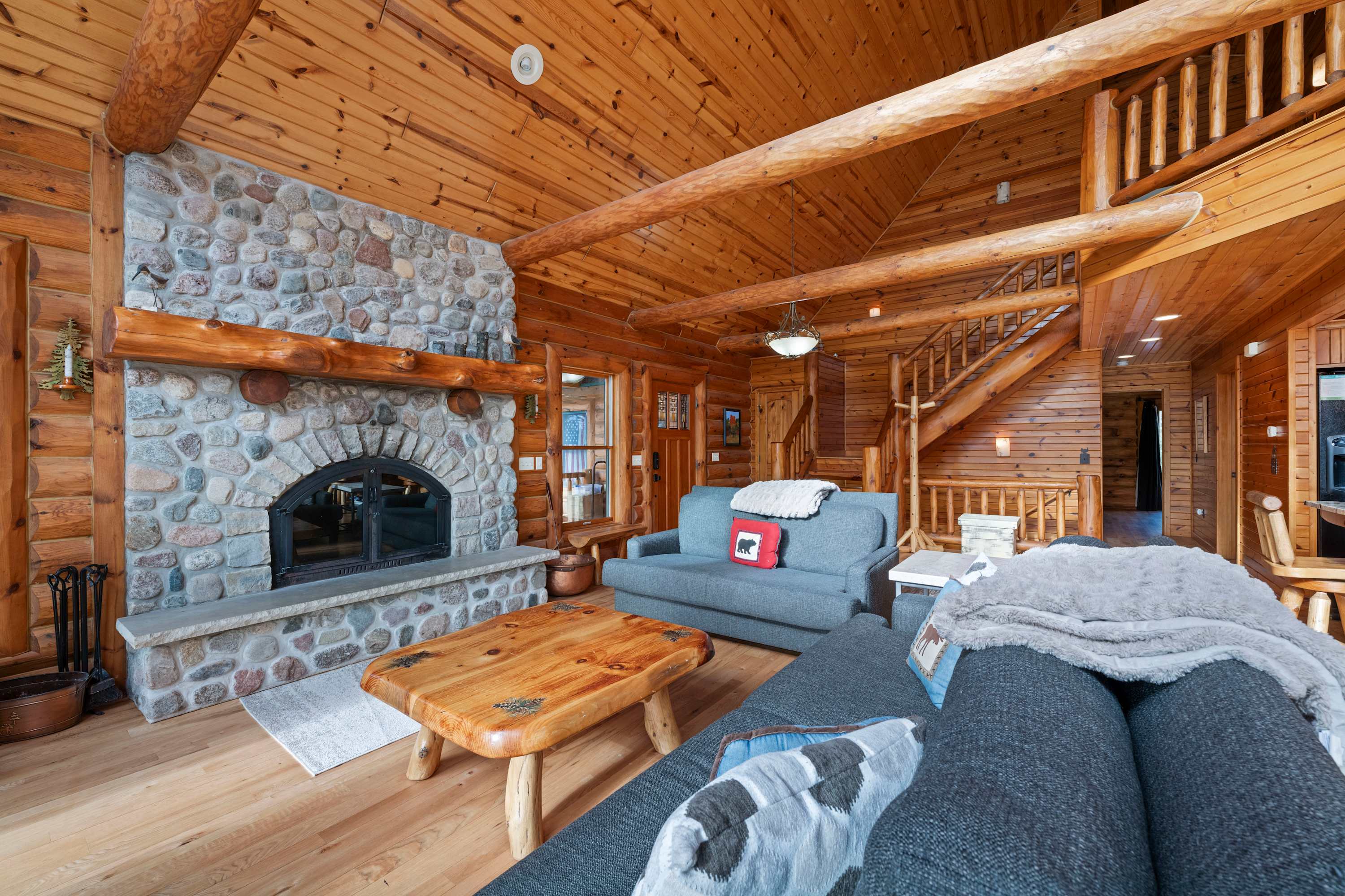 open concept entryway and wood fireplace