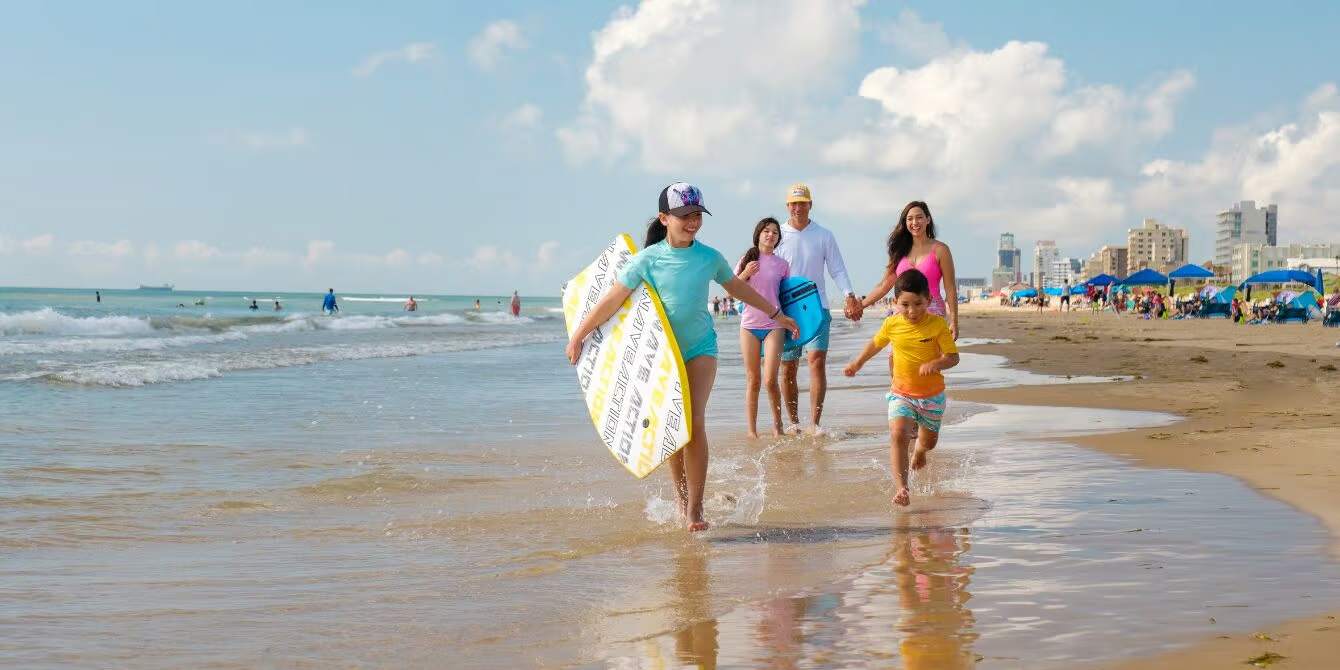Offsite beach experience at South Padre Island where families can play, relax, and enjoy the sun and sand