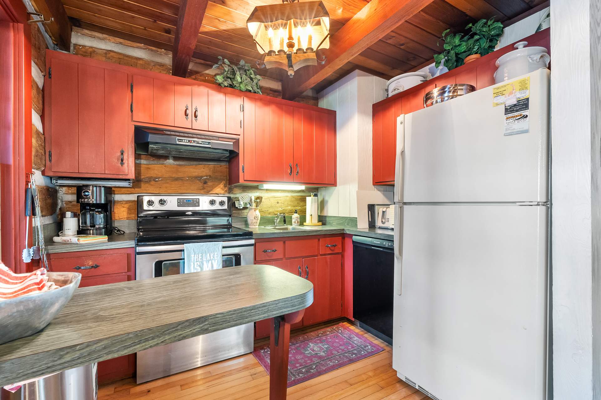 Cozy kitchen is well equipped including a coffee grinder and grill utensils
