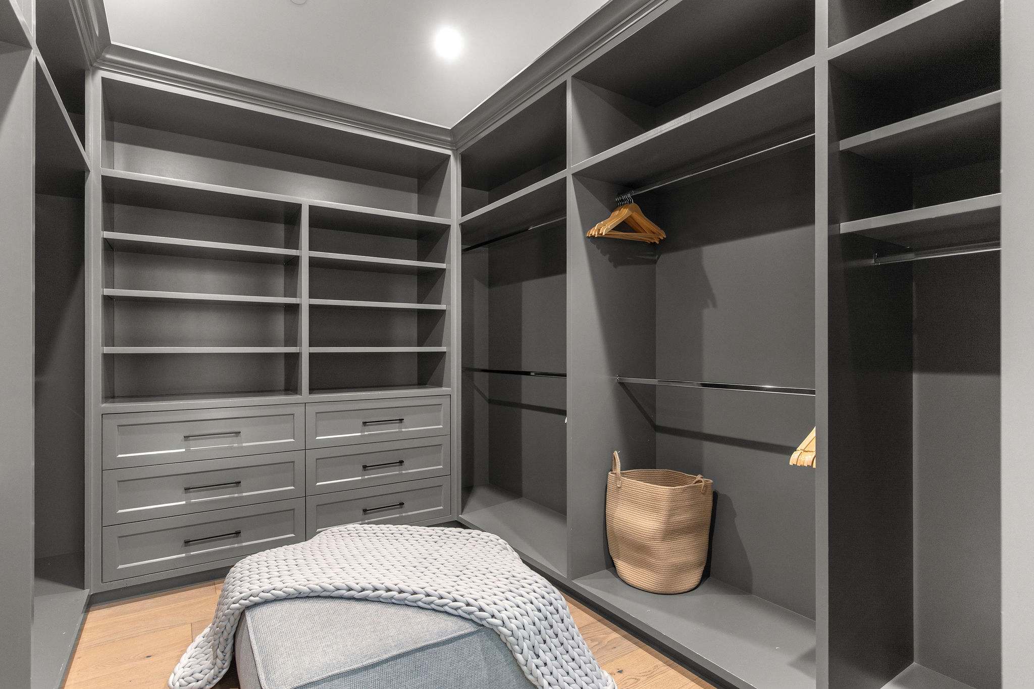 A custom walk-in closet designed for extended stays and full wardrobe storage