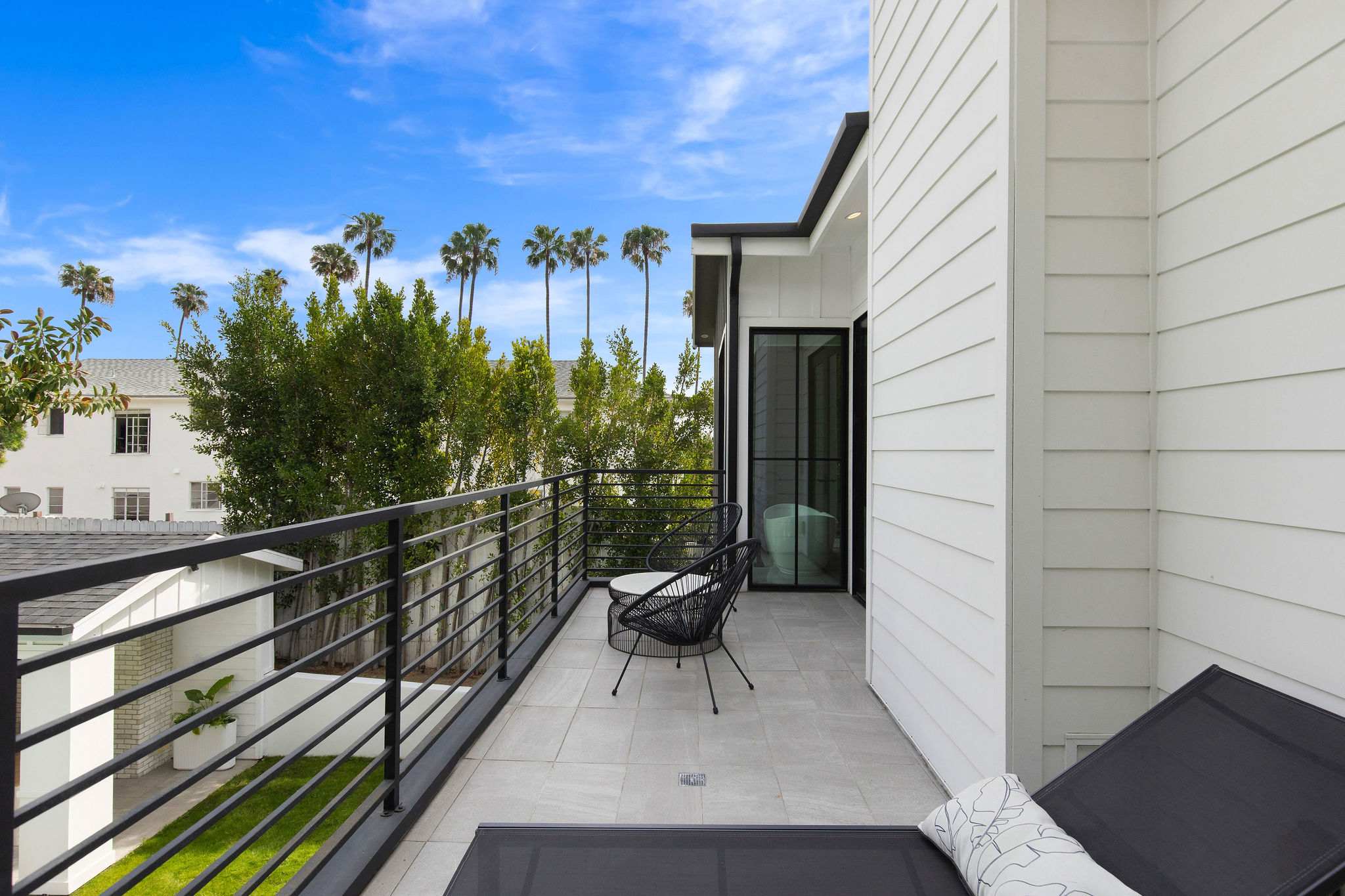 A balcony setting that extends the living space outdoors with a more elevated residential feel