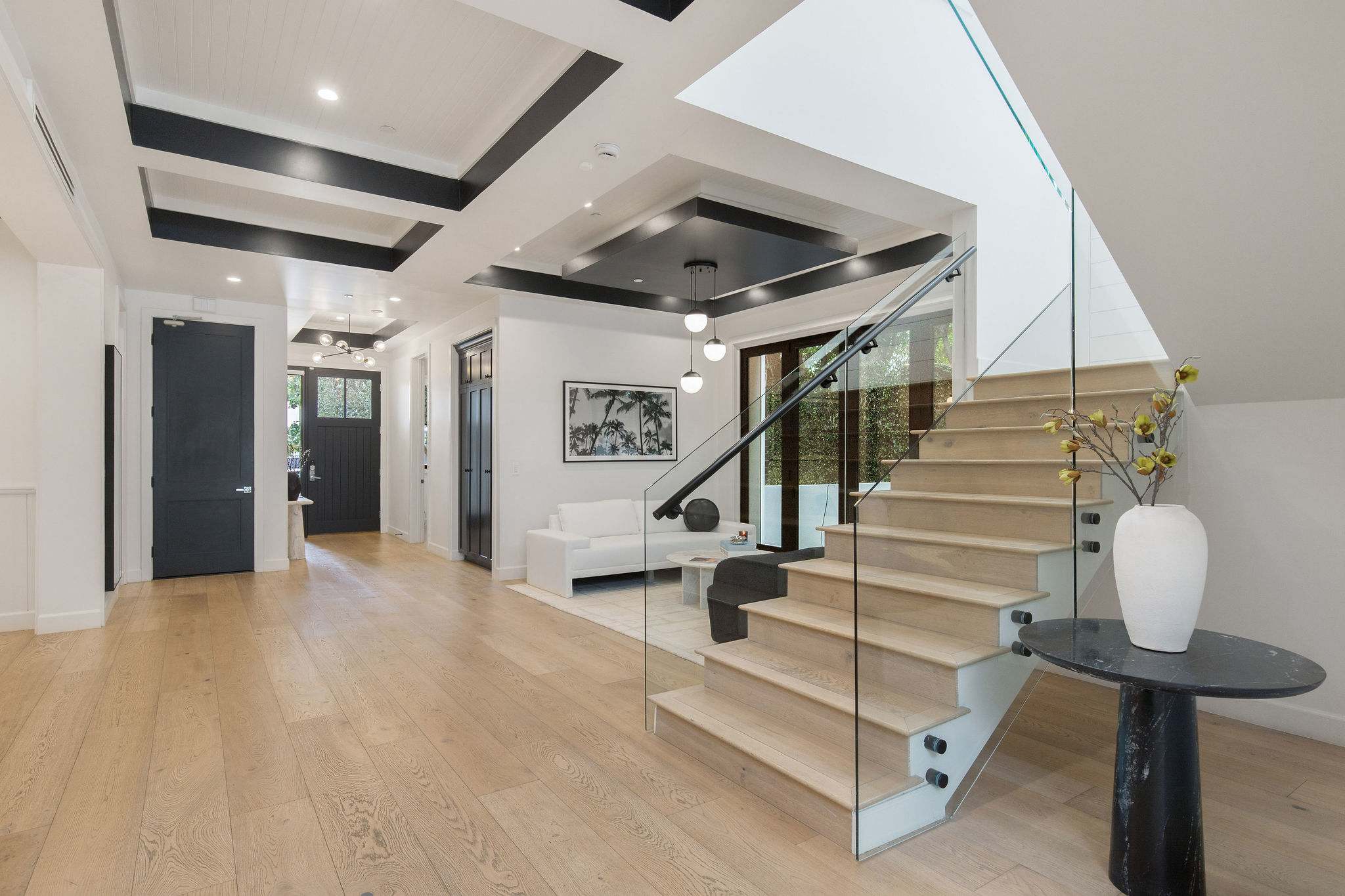 A defined interior entry with open layout and seamless connection across the main living areas