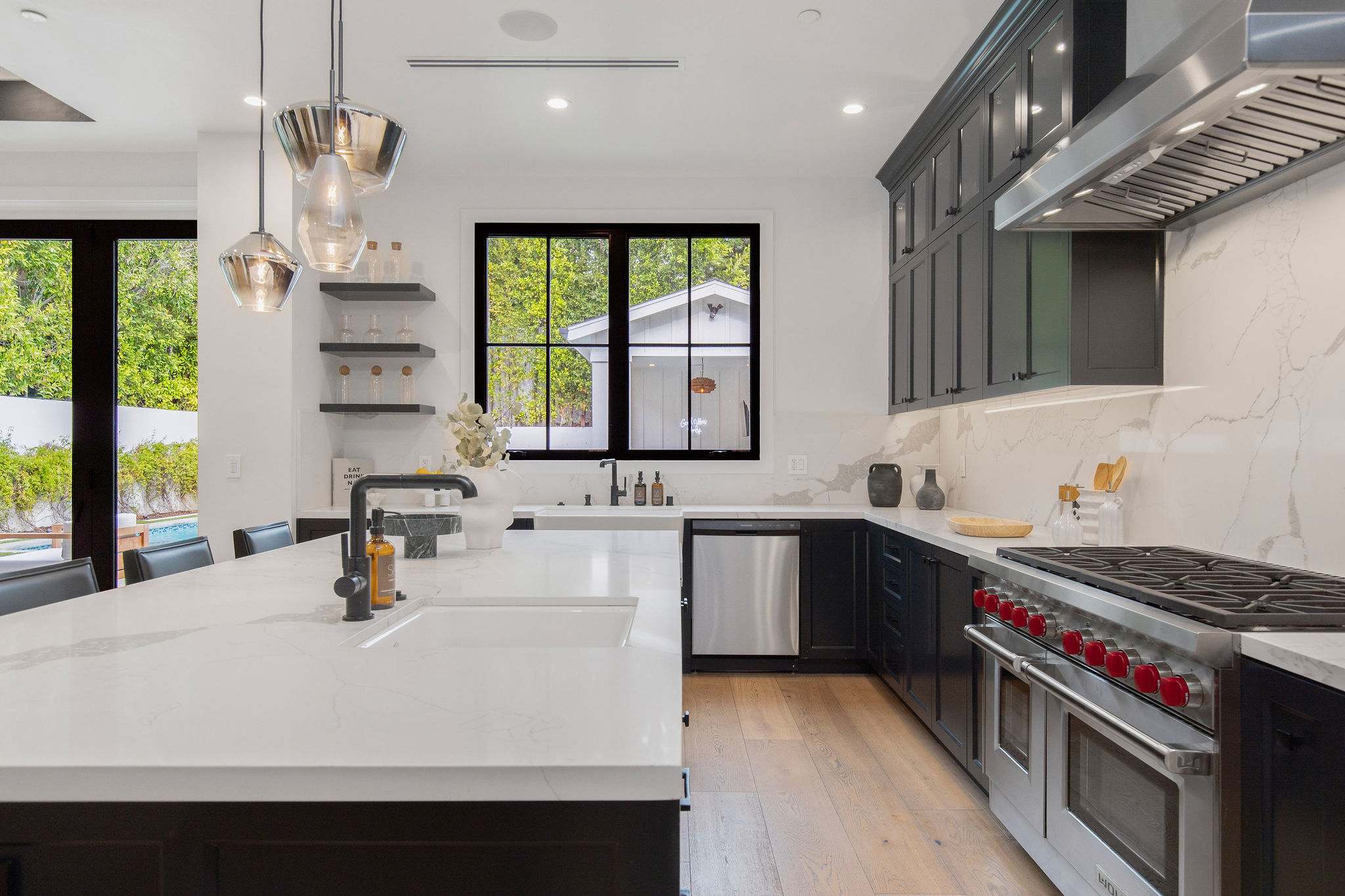 A chef-grade kitchen with commercial range, stone surfaces, and modern farmhouse detailing in West Hollywood