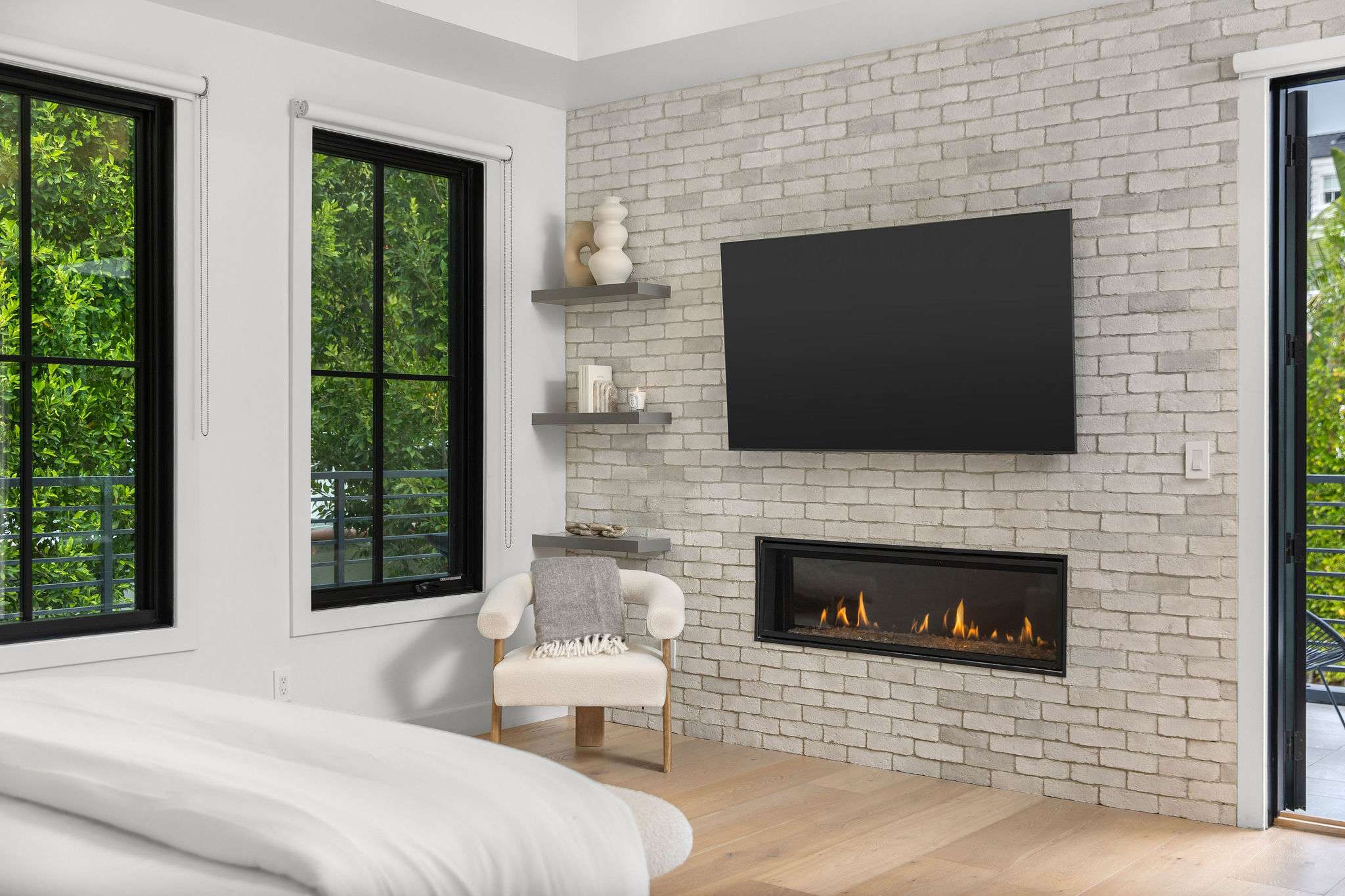 A suite anchored by a fireplace feature, offering a more elevated bedroom experience