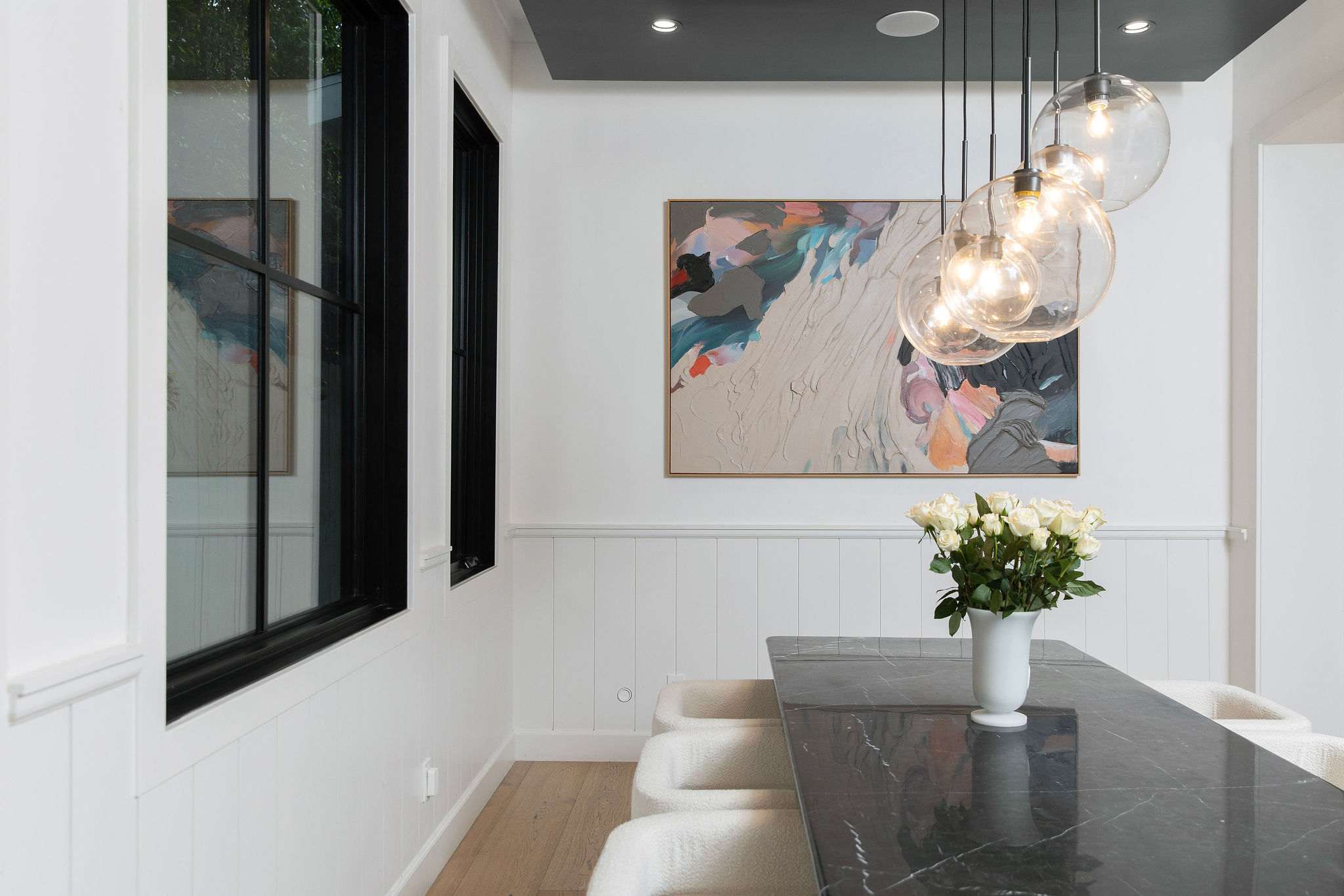A formal dining setting in West Hollywood with statement lighting, custom finishes, and a refined entertaining atmosphere