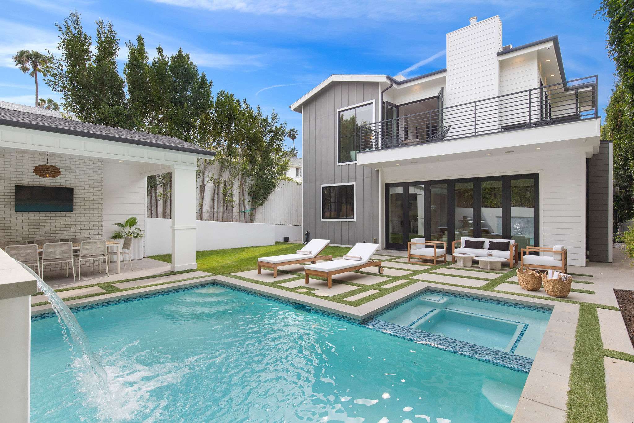 A modern farmhouse in West Hollywood with resort-style pool, spa, and full indoor-outdoor living