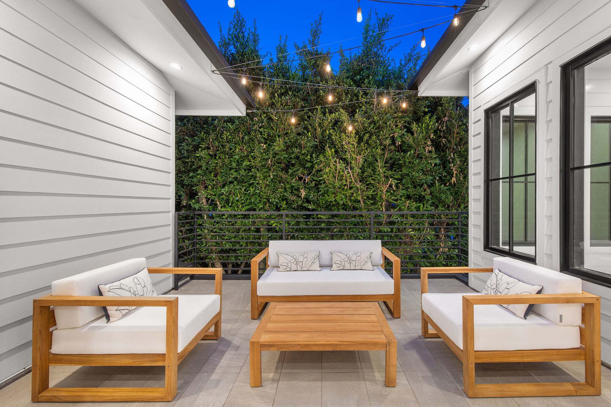A secluded courtyard lounge in West Hollywood designed for outdoor living, privacy, and year-round use