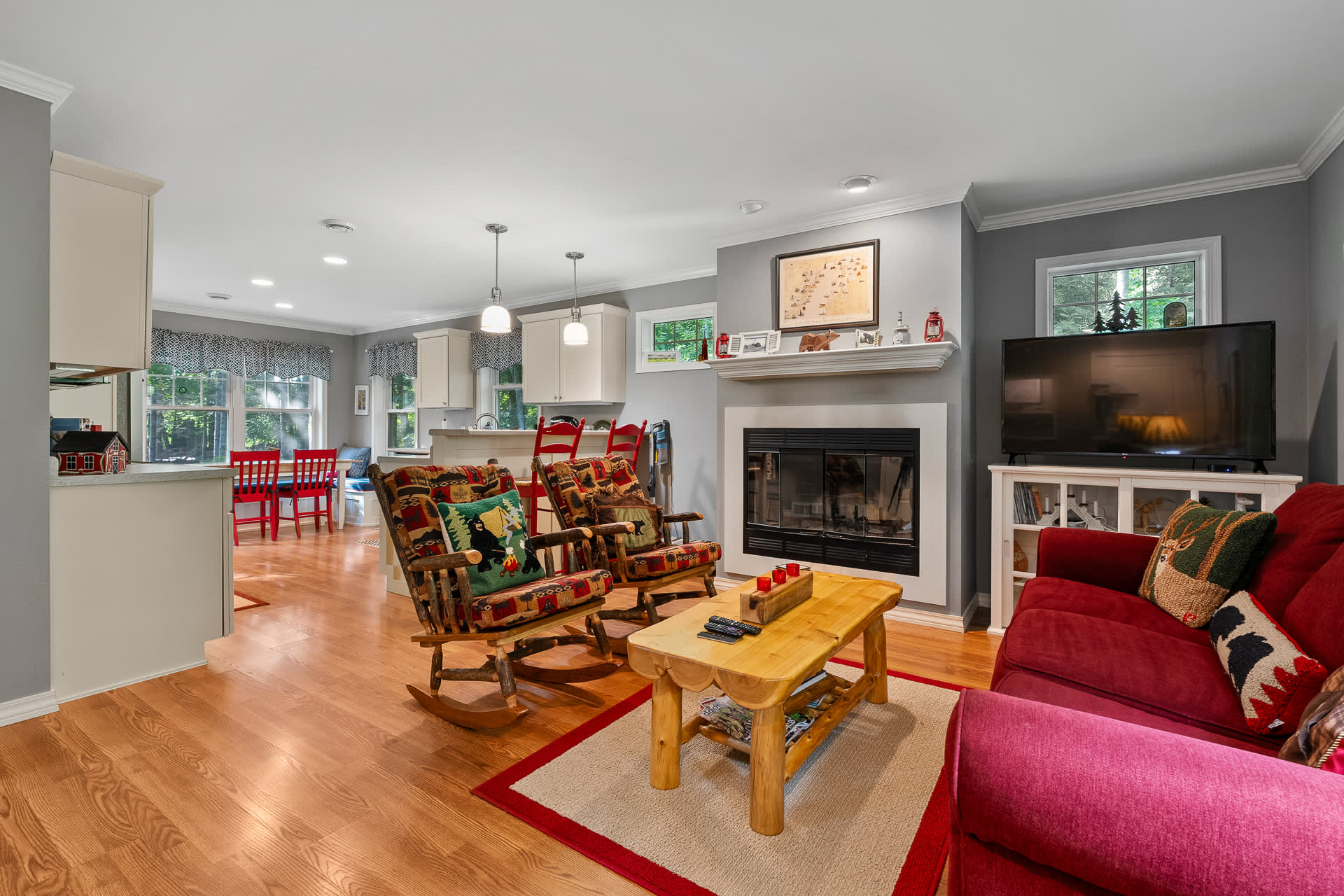 Living room with pull-out queen sleeper sofa + wood burning fireplace!